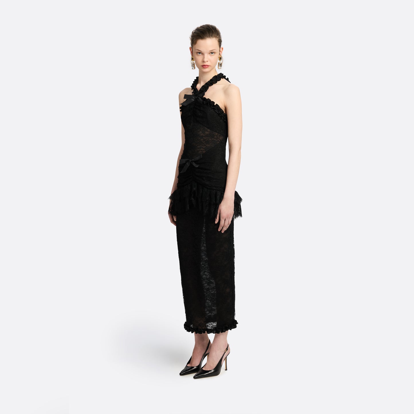 Black Chantilly lace halterneck evening dress with ruffled trims and bows.

Look 26 – Fall Winter 2026 Lookbook.
