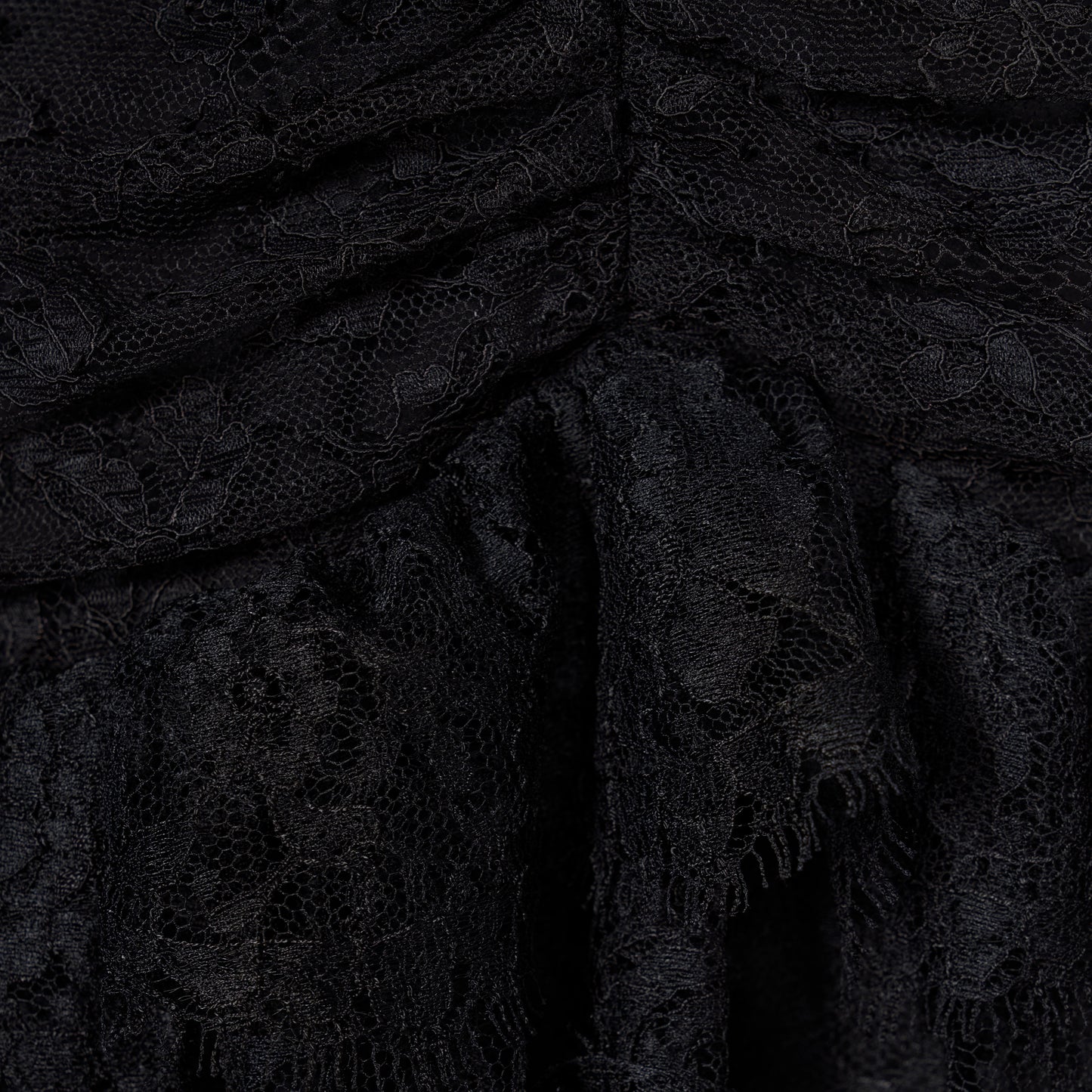 Black Chantilly lace halterneck evening dress with ruffled trims and bows.

Look 26 – Fall Winter 2026 Lookbook.
