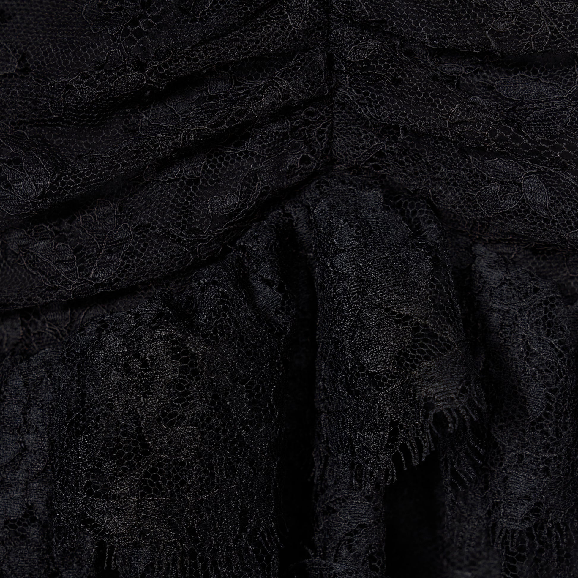 Black Chantilly lace halterneck evening dress with ruffled trims and bows.

Look 26 – Fall Winter 2026 Lookbook.