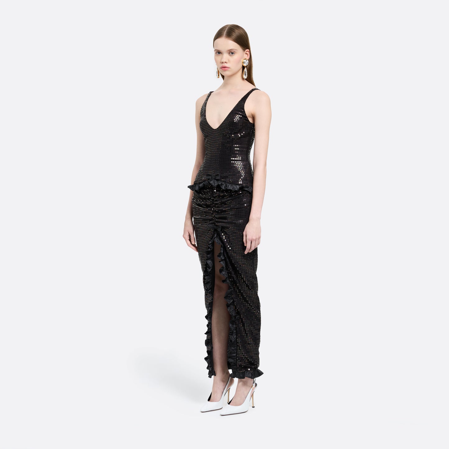 Black sequin-embroidered stretch silk georgette sleeveless dress cut to a fitted silhouette with a scoop neckline. Finished with ruffled trims at the waist and hem.

Look 25 – Fall Winter 2026 Lookbook.