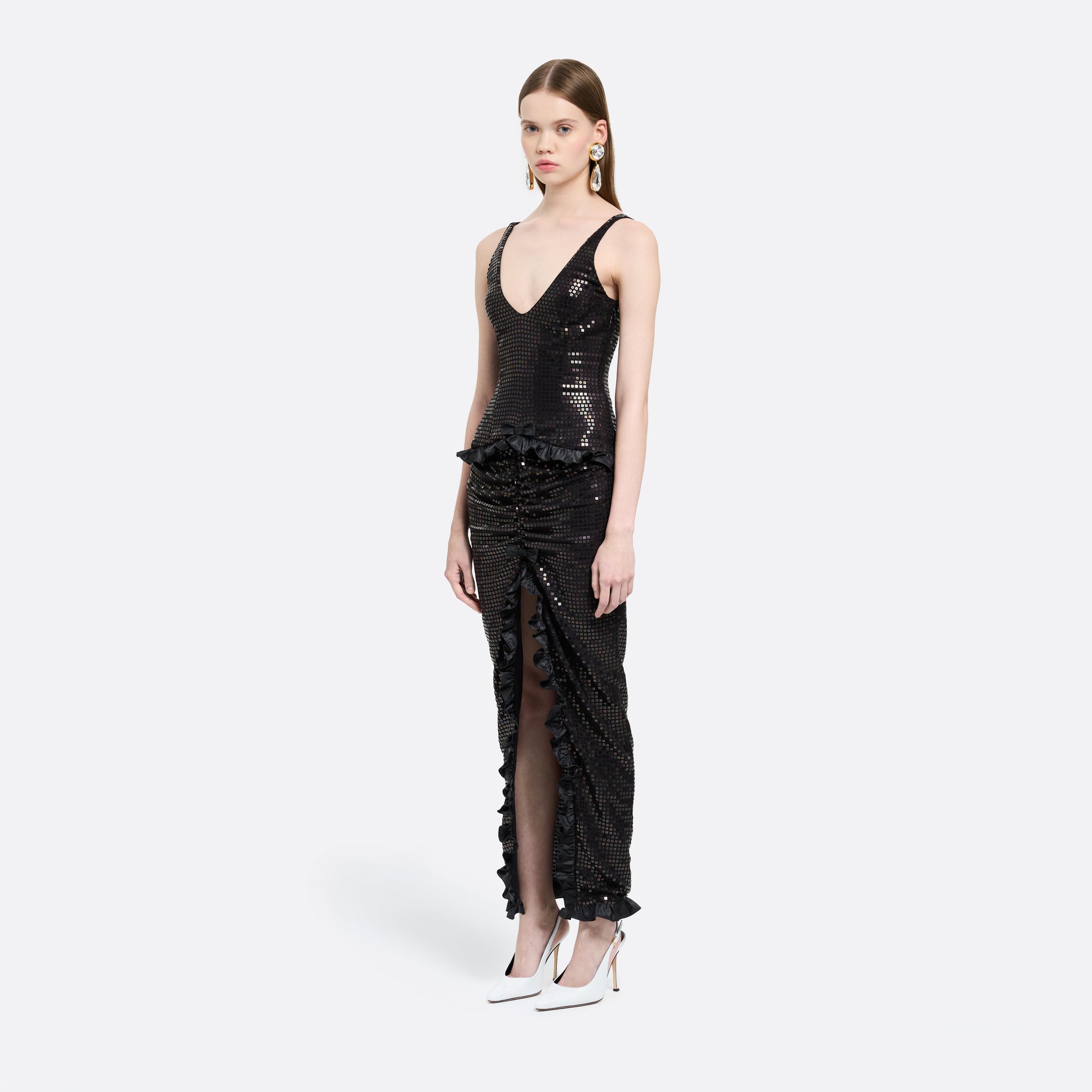 Black sequin-embroidered stretch silk georgette sleeveless dress cut to a fitted silhouette with a scoop neckline. Finished with ruffled trims at the waist and hem.

Look 25 – Fall Winter 2026 Lookbook.