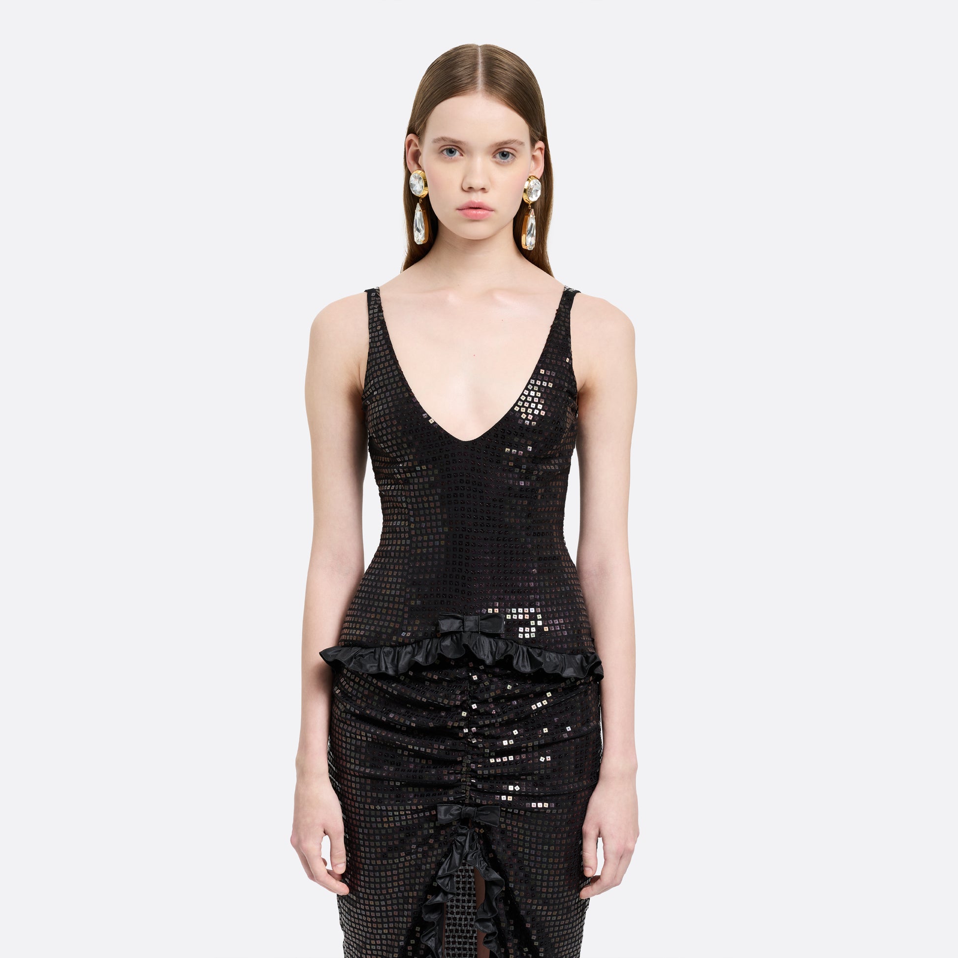 Black sequin-embroidered stretch silk georgette sleeveless dress cut to a fitted silhouette with a scoop neckline. Finished with ruffled trims at the waist and hem.

Look 25 – Fall Winter 2026 Lookbook.