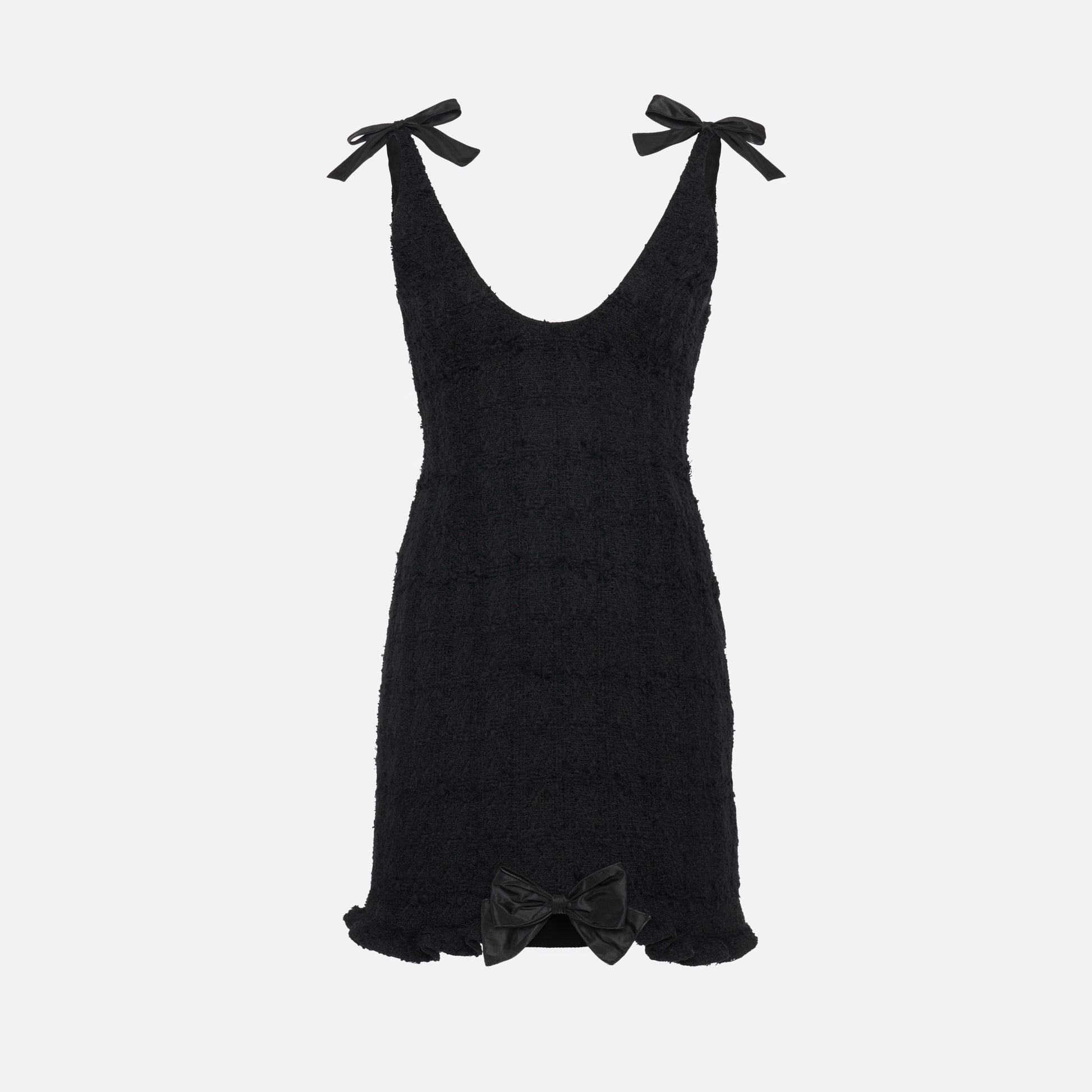 Black check tweed bouclé mini dress with a fitted silhouette and a soft ruffle at the hem. The shoulder straps are finished with bows.

Look 16 – Fall Winter 2026 Lookbook.