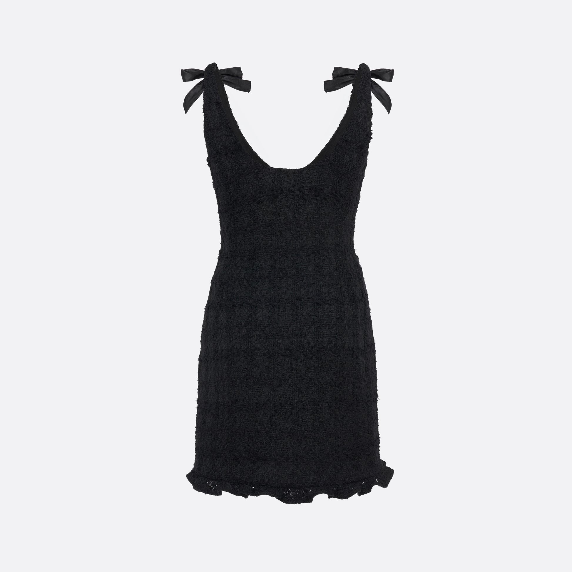Black check tweed bouclé mini dress with a fitted silhouette and a soft ruffle at the hem. The shoulder straps are finished with bows.

Look 16 – Fall Winter 2026 Lookbook.