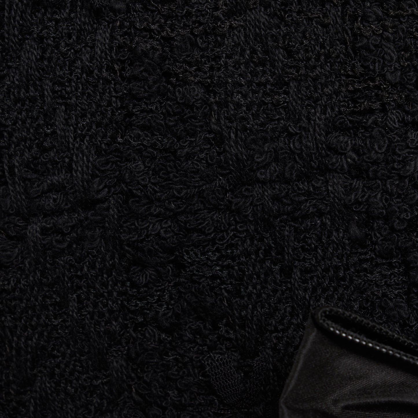 Black check tweed bouclé mini dress with a fitted silhouette and a soft ruffle at the hem. The shoulder straps are finished with bows.

Look 16 – Fall Winter 2026 Lookbook.