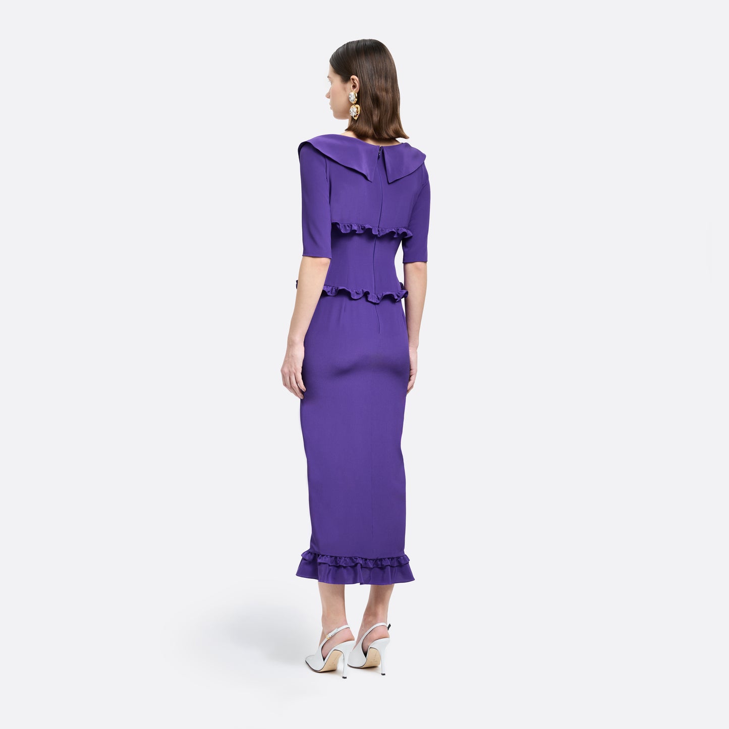 Purple silk crêpe de chine dress with a wide collar, ruffle details, bows and a centre split.

Look 7 – Fall Winter 2026 Lookbook.