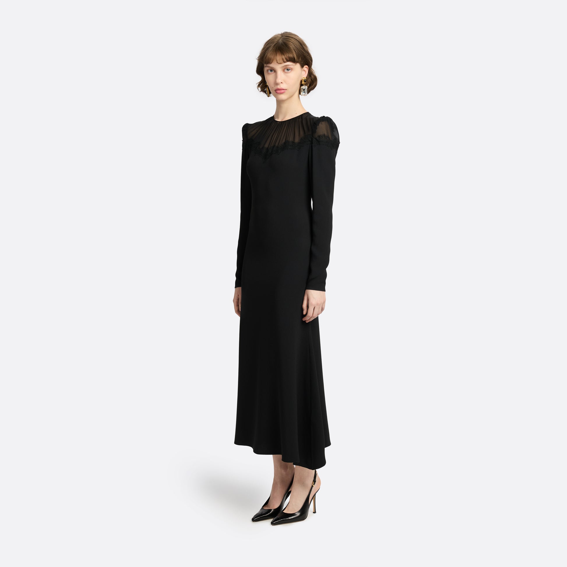 Black cady and silk georgette midi dress cut to a fitted silhouette with an A-line skirt. Finished with a sheer pleated yoke with delicate lace inlay.