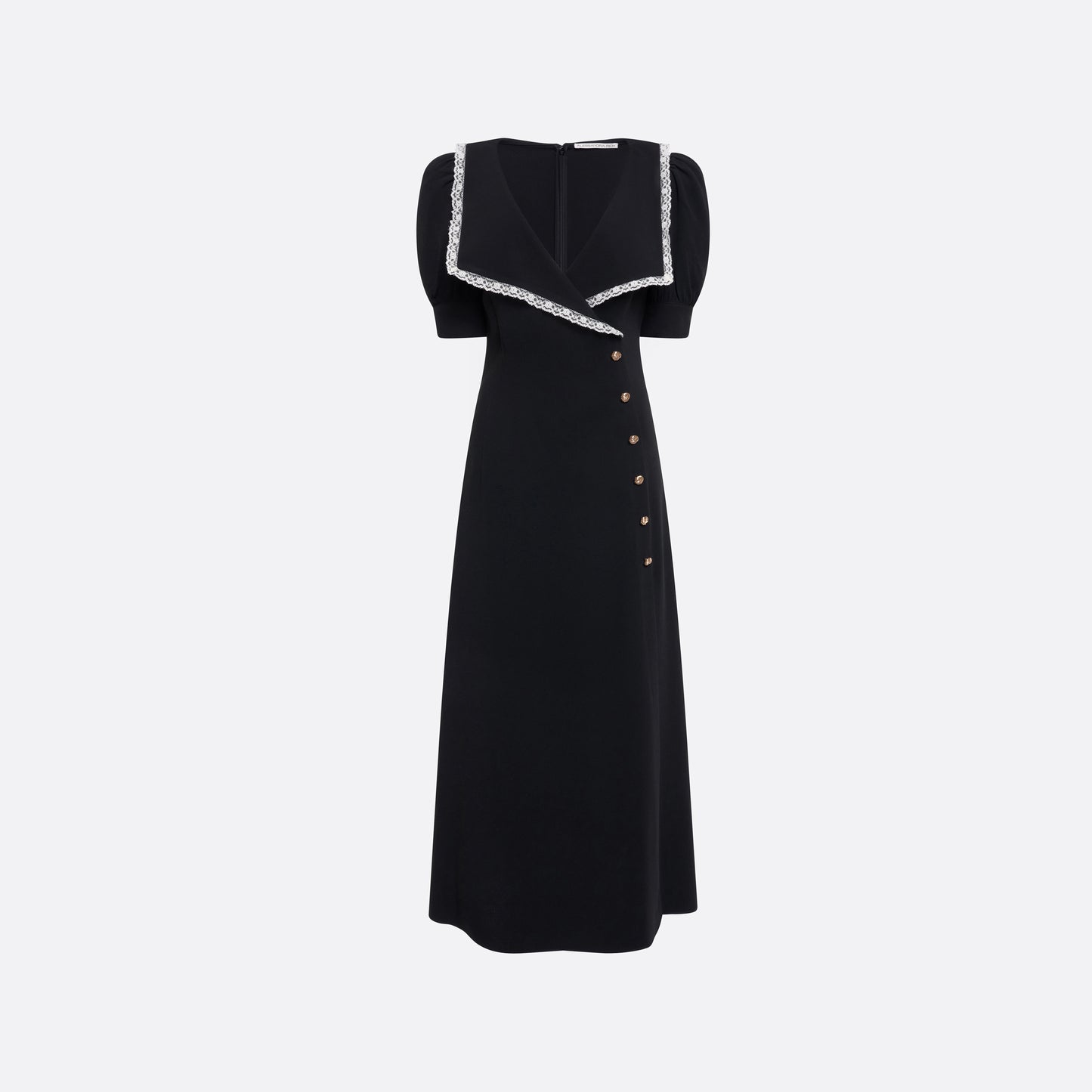 Black cady midi dress with a wrap-style silhouette and asymmetric button detailing. The wide collar is finished with a white lace trim.

Look 23 – Fall Winter 2026 Lookbook.