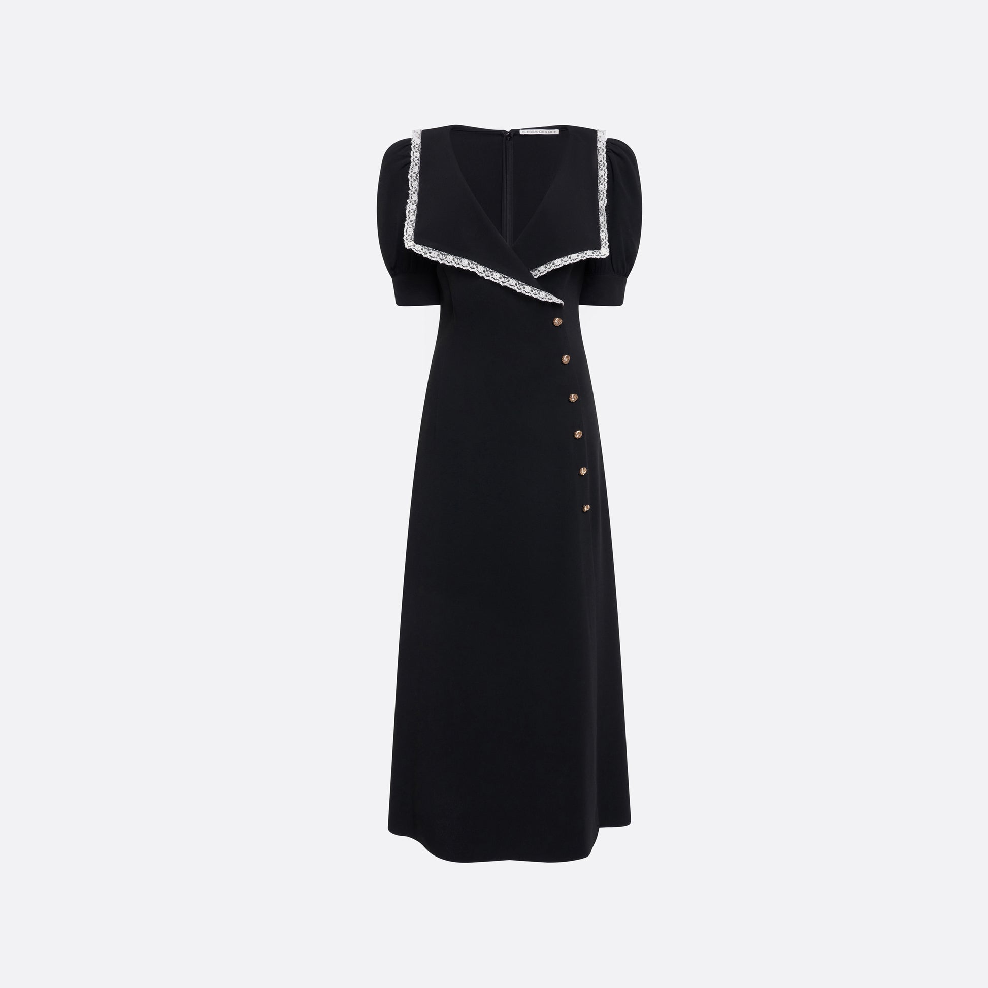 Black cady midi dress with a wrap-style silhouette and asymmetric button detailing. The wide collar is finished with a white lace trim.

Look 23 – Fall Winter 2026 Lookbook.