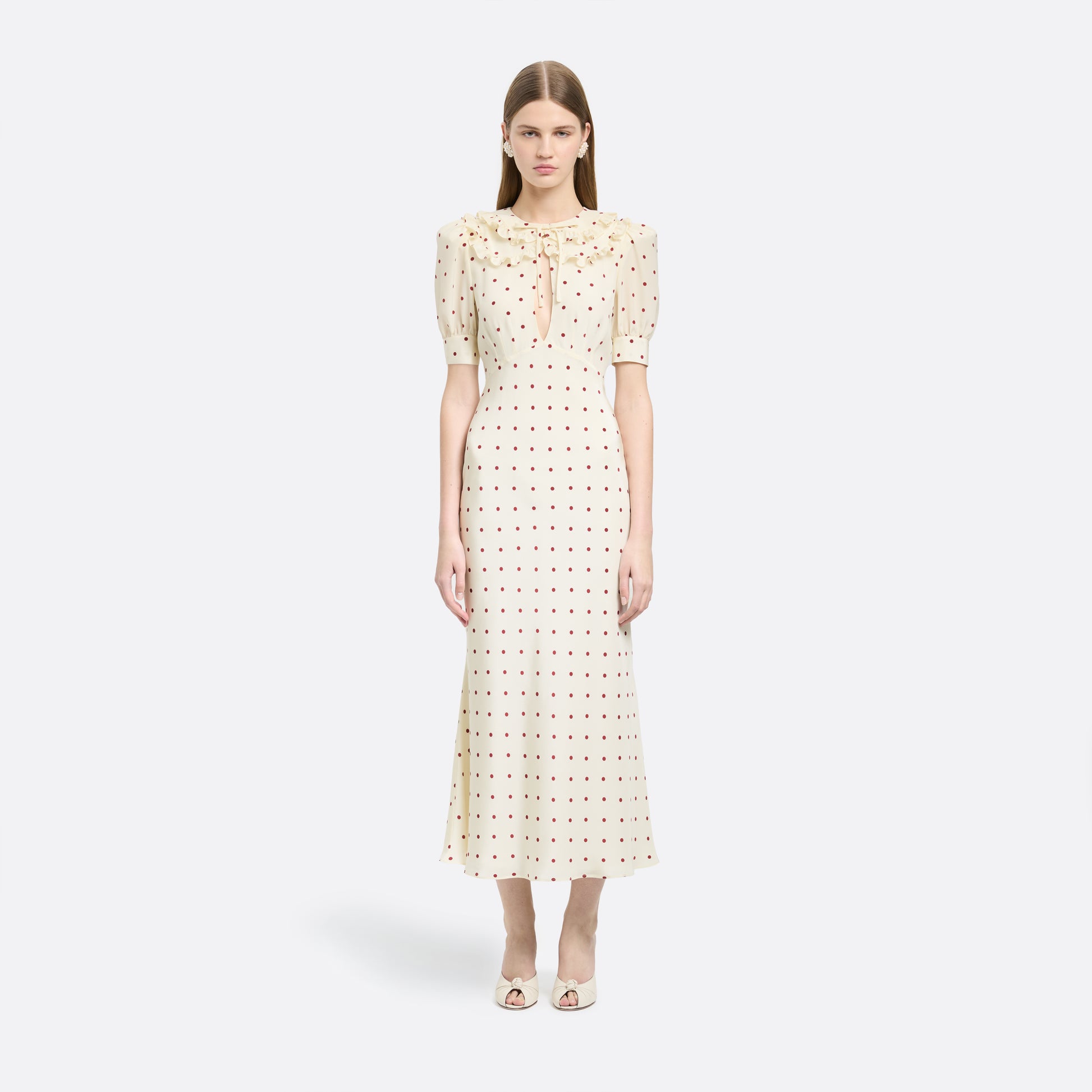 Cream and bordeaux polka-dot silk crêpe de chine midi dress with short puff sleeves and a ruffled collar finished with a tie detail.