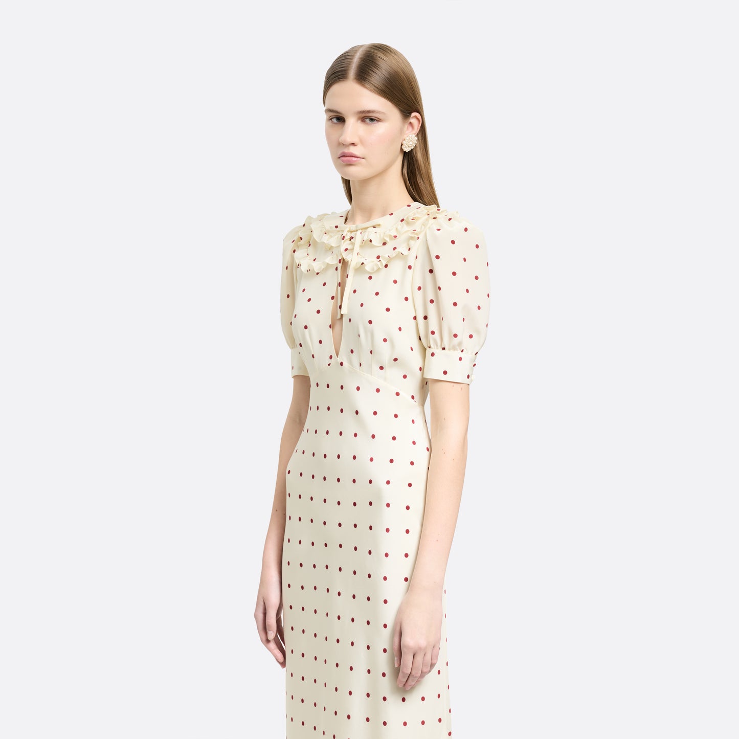 Cream and bordeaux polka-dot silk crêpe de chine midi dress with short puff sleeves and a ruffled collar finished with a tie detail.