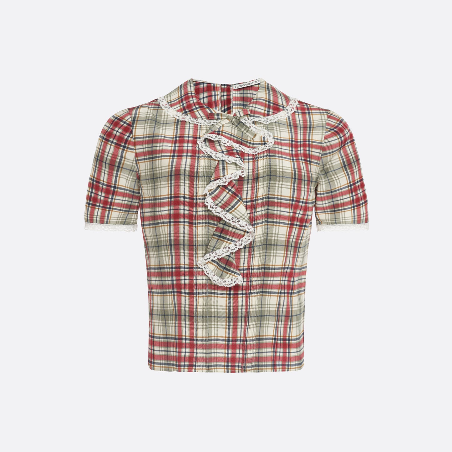 Red and green tartan-print  silk crêpe de chine blouse with small collar, jabot and short sleeves all trimmed in white lace. The blouse is fastened with a back button closure.

Look 32 – Fall Winter 2026 Lookbook.