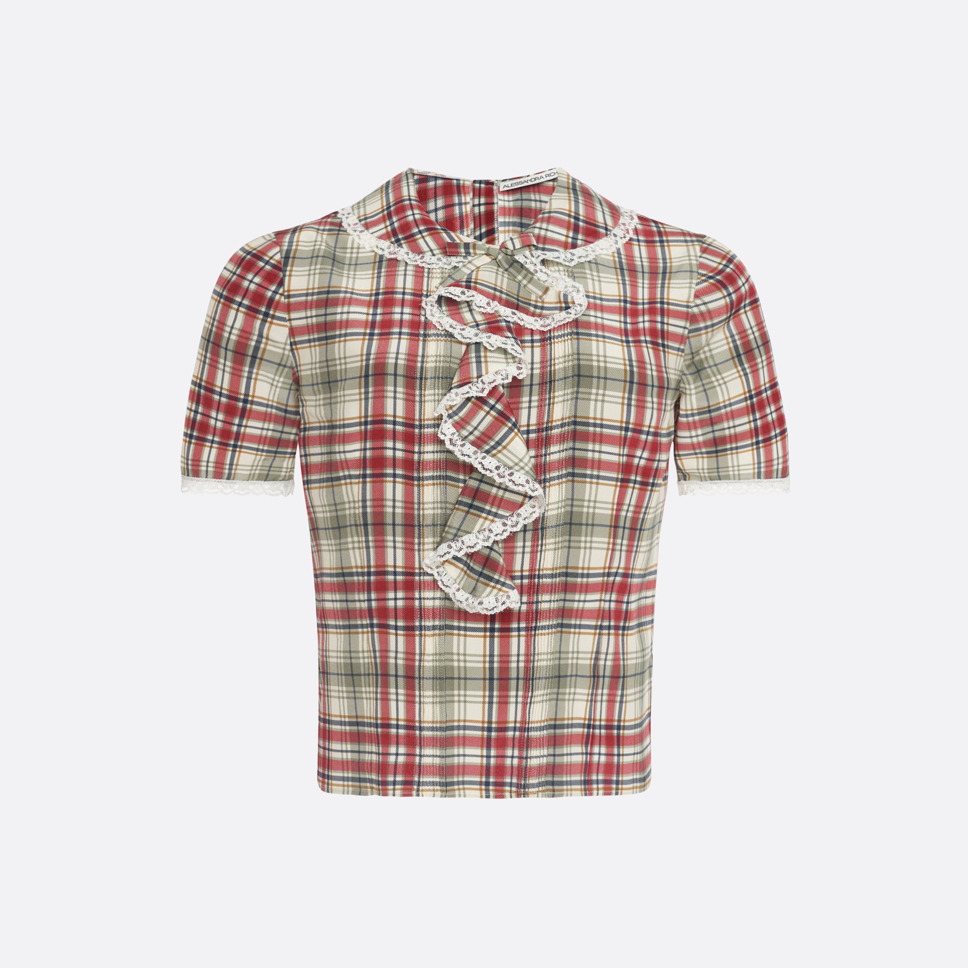 Red and green tartan-print  silk crêpe de chine blouse with small collar, jabot and short sleeves all trimmed in white lace. The blouse is fastened with a back button closure.

Look 32 – Fall Winter 2026 Lookbook.