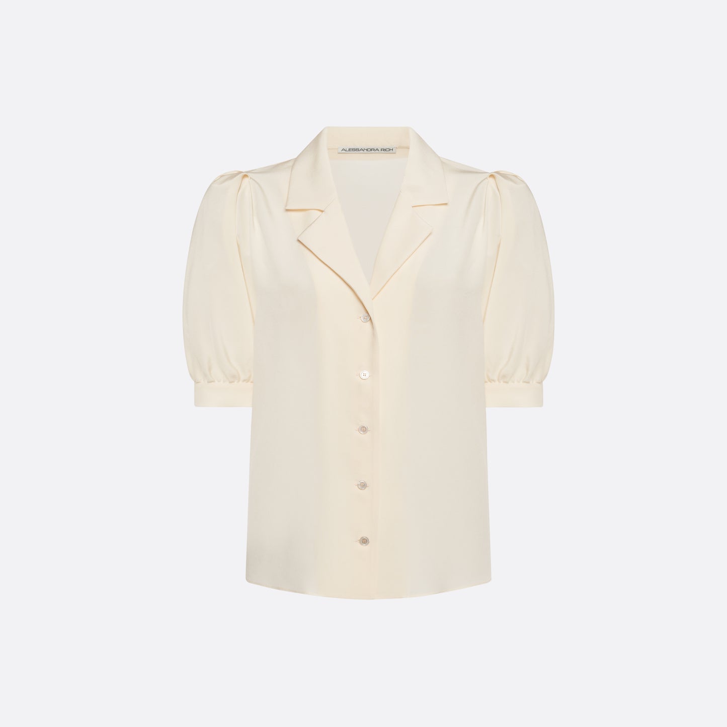 Cream silk crêpe de chine blouse with a short puff sleeves and a front button closure.