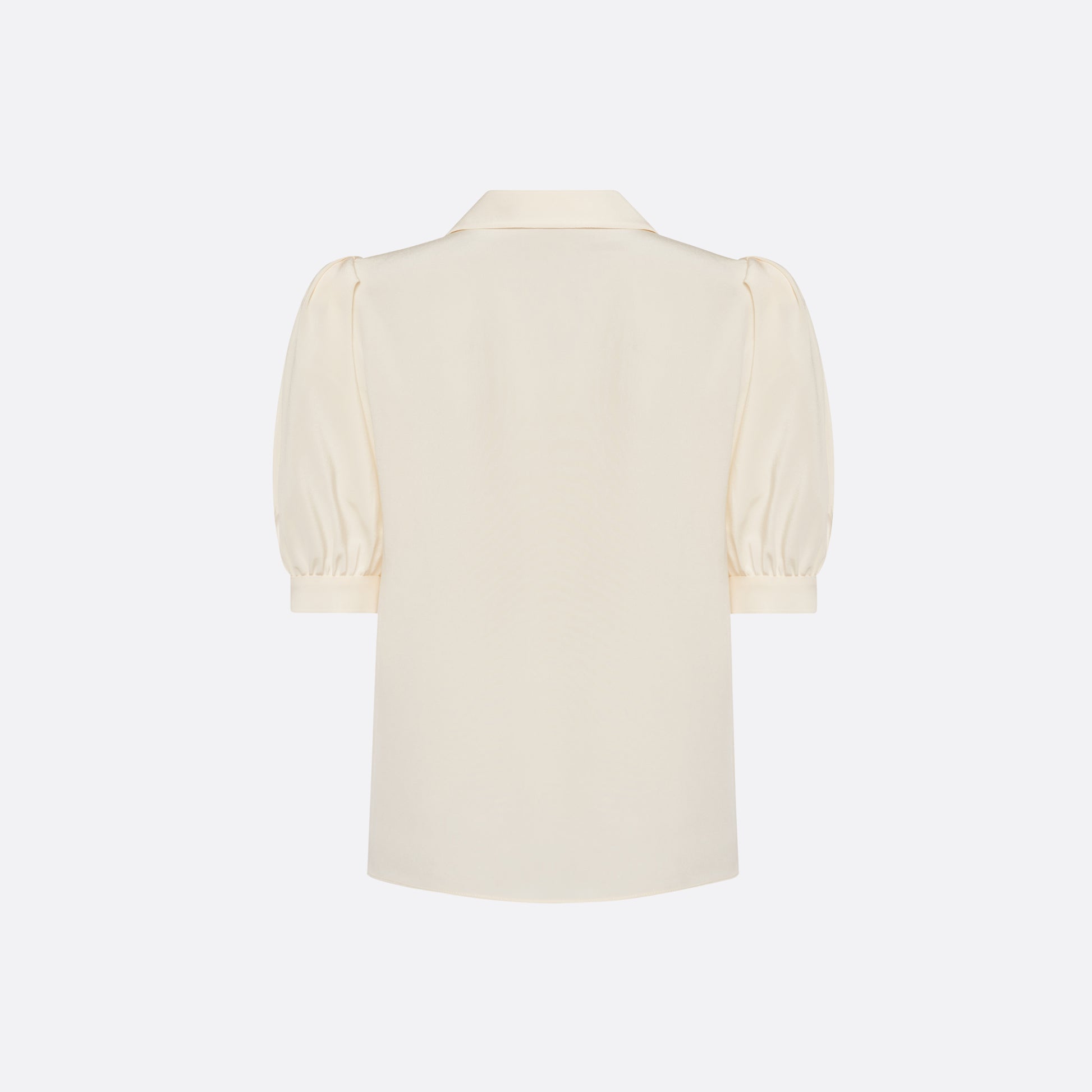 Cream silk crêpe de chine blouse with a short puff sleeves and a front button closure.