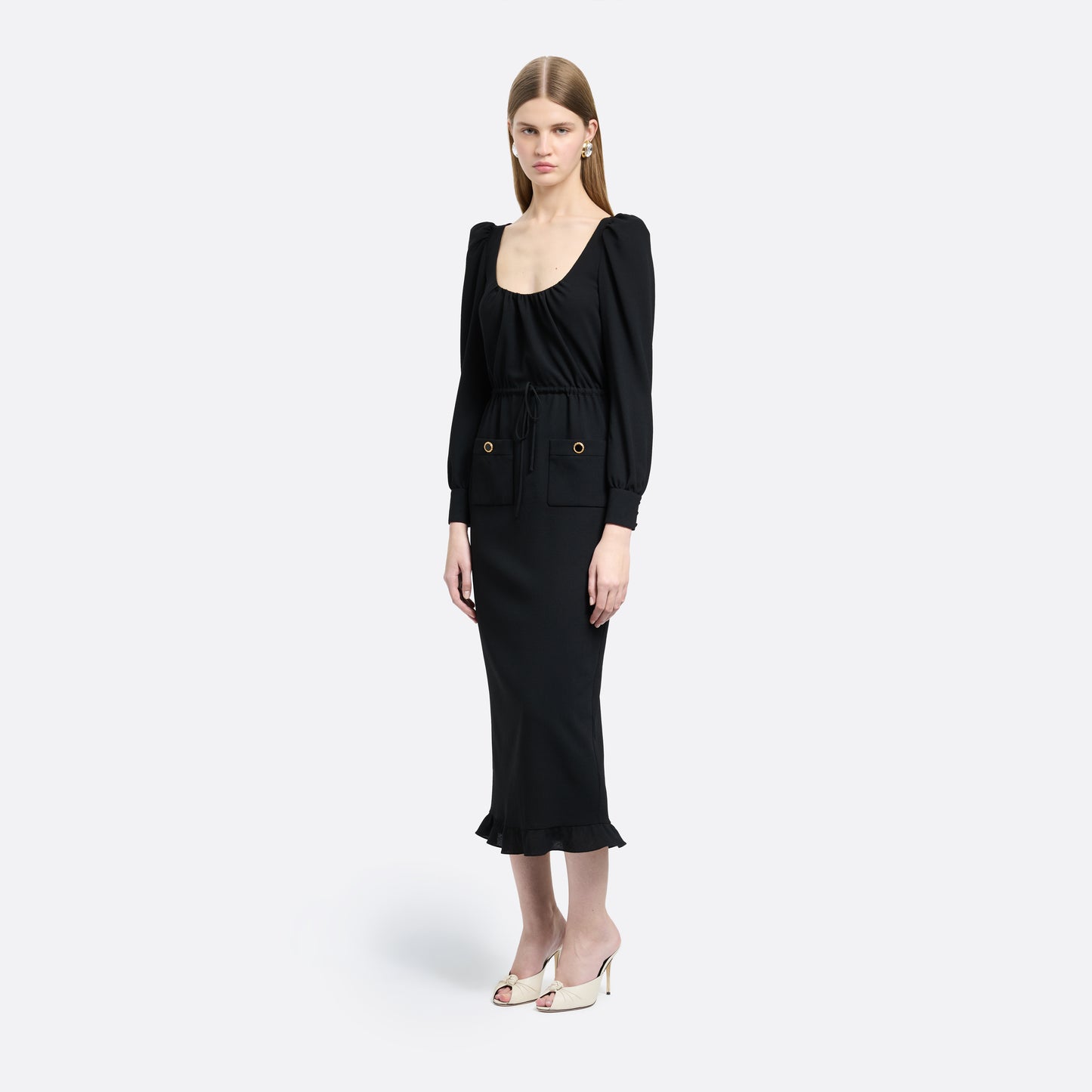 Black light wool crêpe midi dress with a scoop neckline, long sleeves and a drawstring waist. Finished with patch pockets and black and gold-tone buttons.