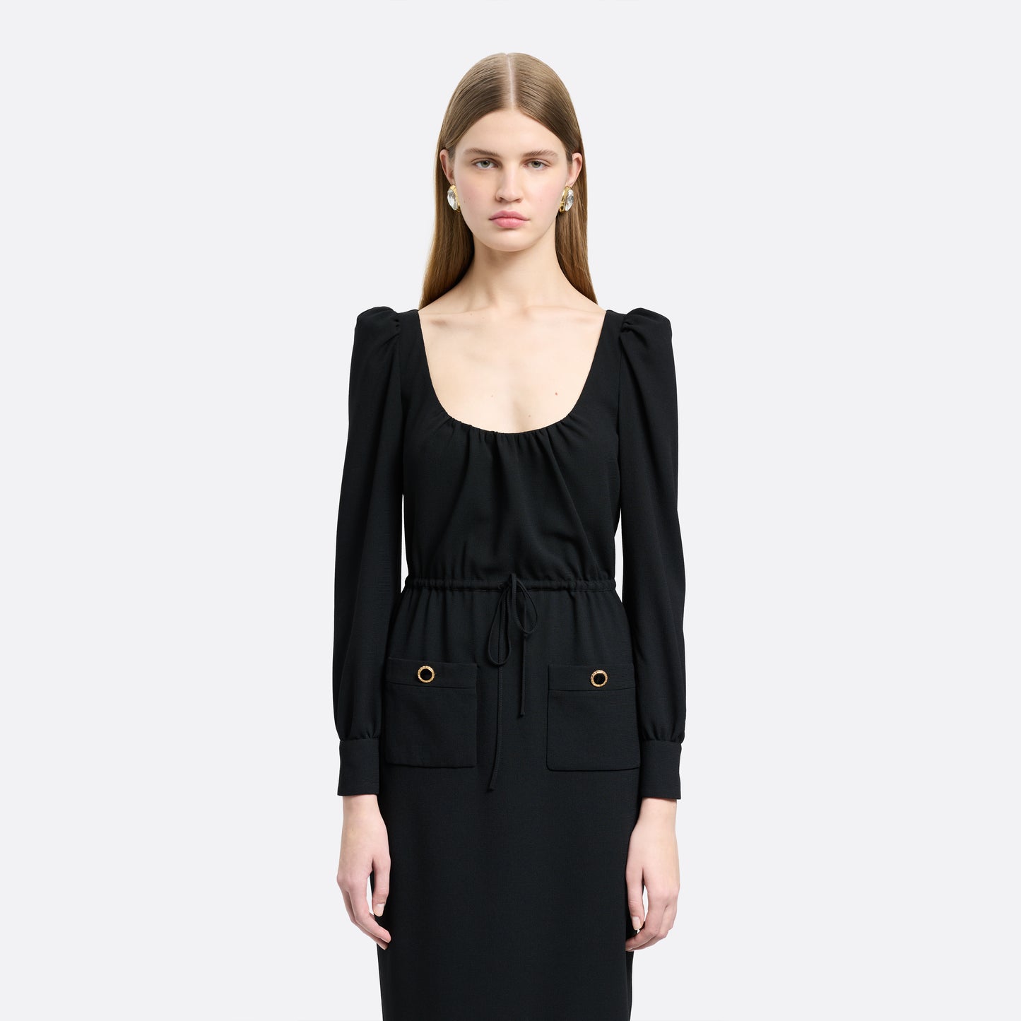 Black light wool crêpe midi dress with a scoop neckline, long sleeves and a drawstring waist. Finished with patch pockets and black and gold-tone buttons.
