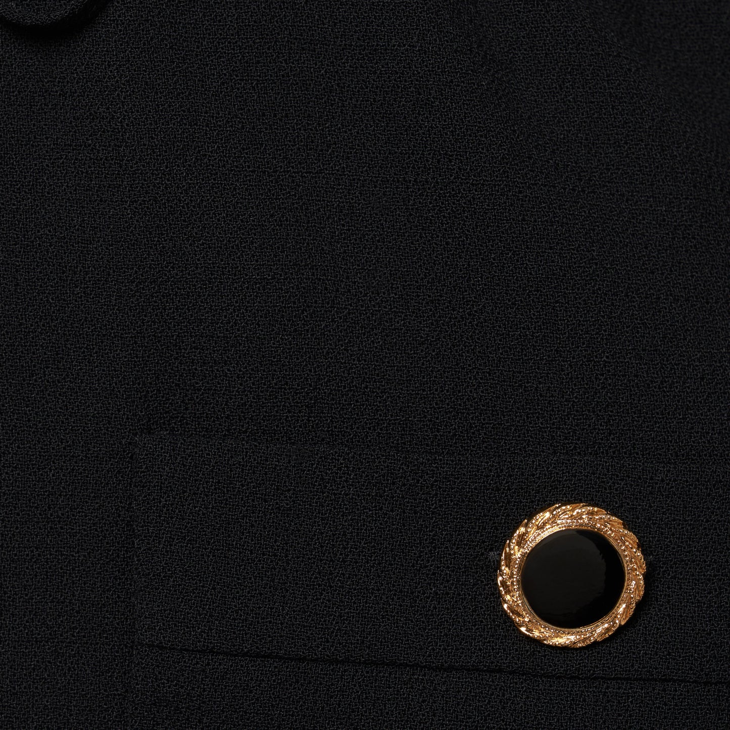 Black light wool crêpe midi dress with a scoop neckline, long sleeves and a drawstring waist. Finished with patch pockets and black and gold-tone buttons.