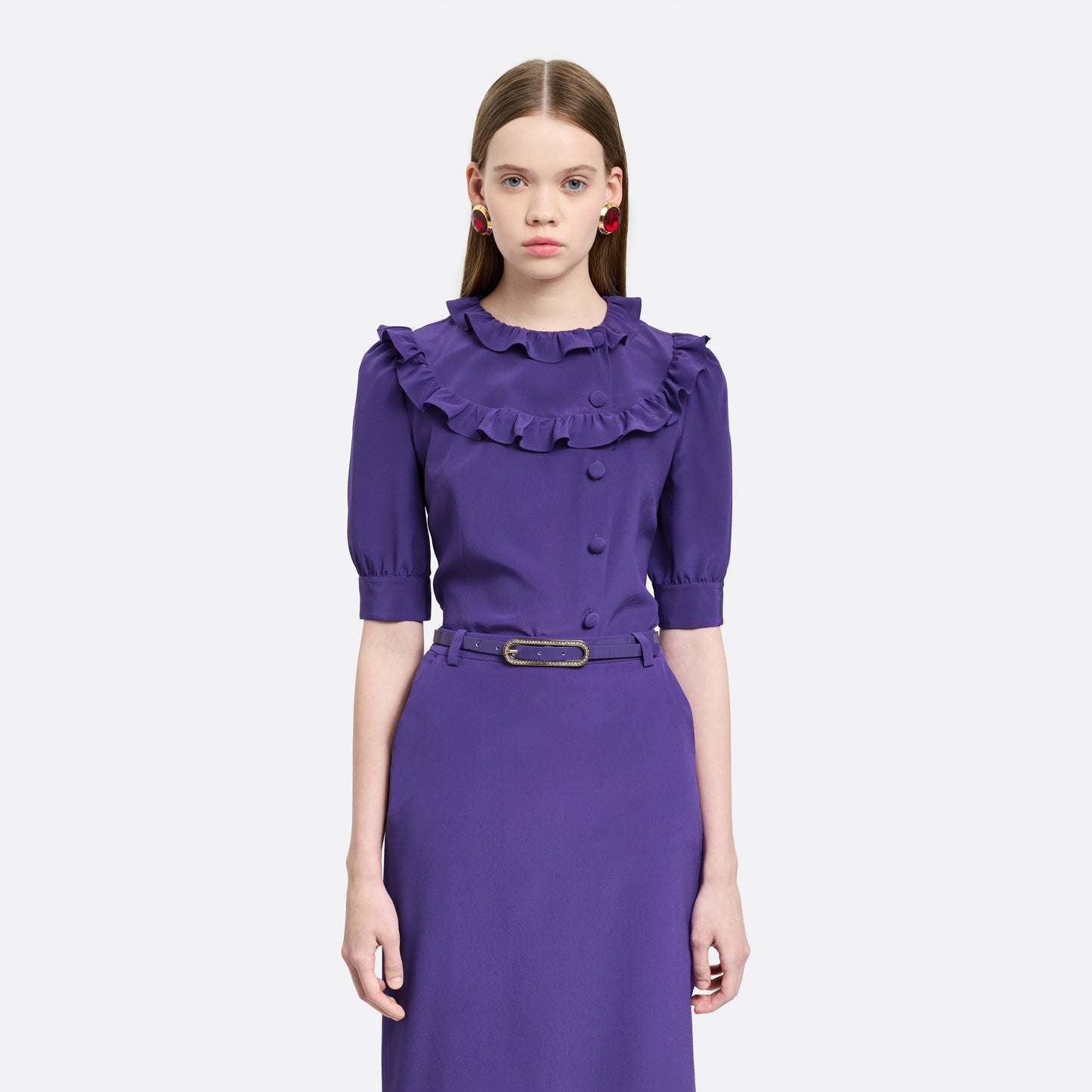 Purple silk crêpe de chine blouse with ruffle trims, short puff sleeves and a side button closure.

Look 7 – Fall Winter 2026 Lookbook.