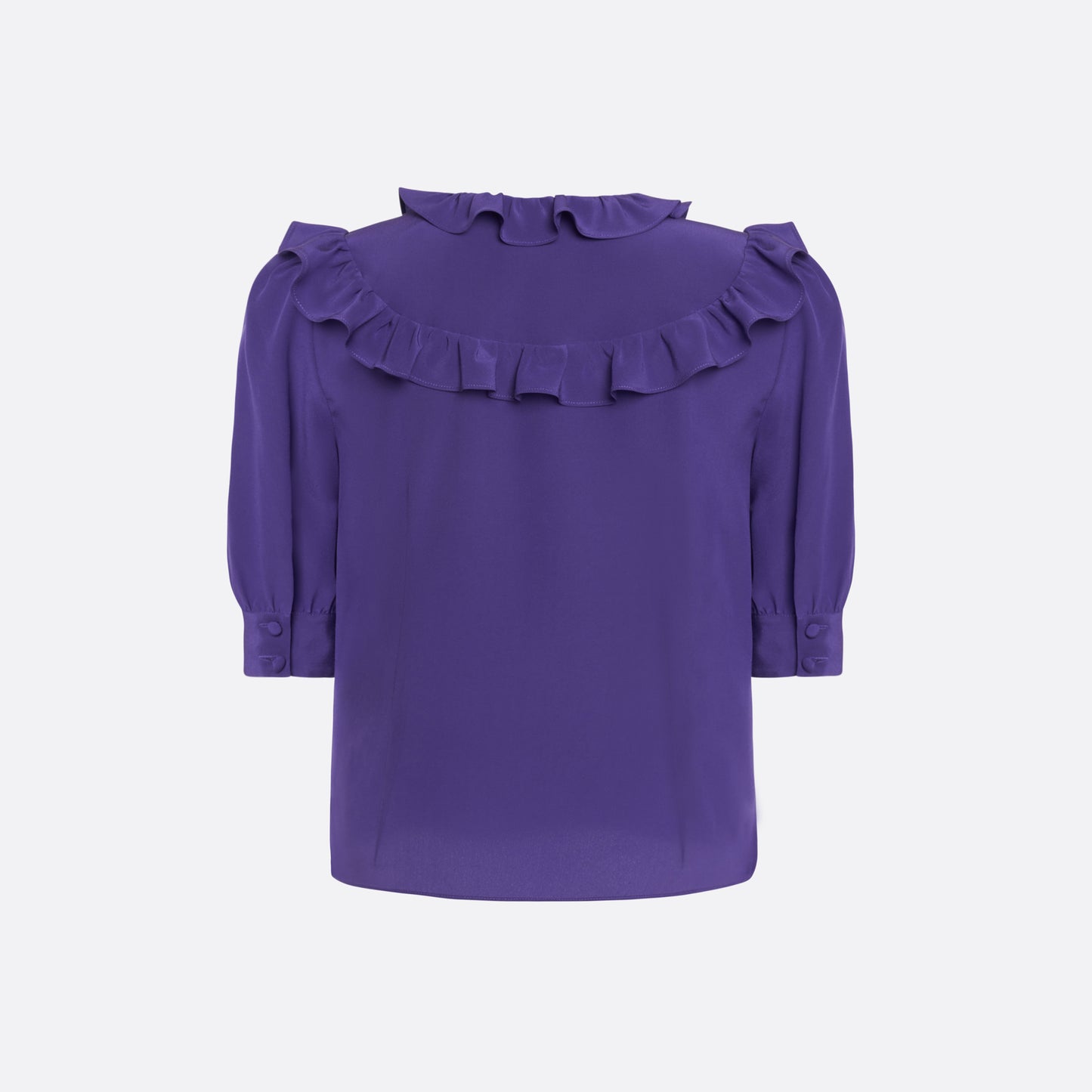 Purple silk crêpe de chine blouse with ruffle trims, short puff sleeves and a side button closure.

Look 7 – Fall Winter 2026 Lookbook.