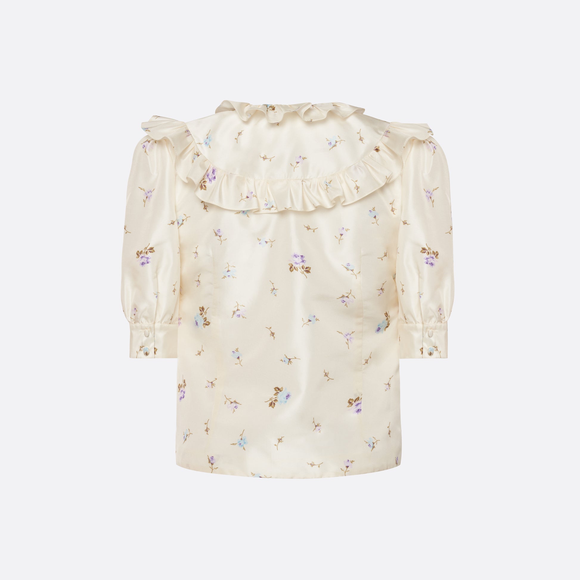 Floral-print white silk taffeta blouse with ruffle trims, short puff sleeves and a side button closure.