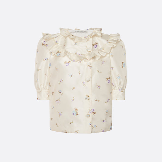 Floral-print white silk taffeta blouse with ruffle trims, short puff sleeves and a side button closure.