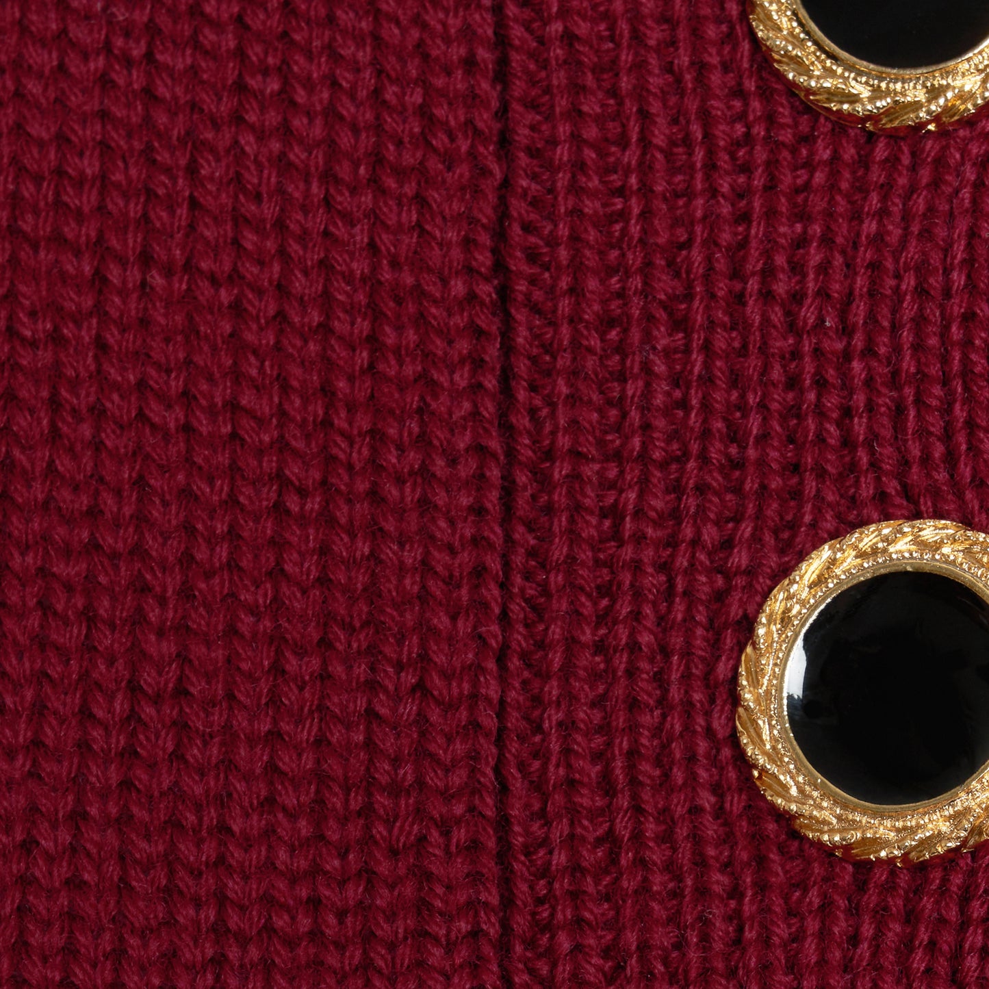 Bordeaux merino wool lace-knit polo cut to a fitted silhouette with short puff sleeves and black and gold-tone buttons.