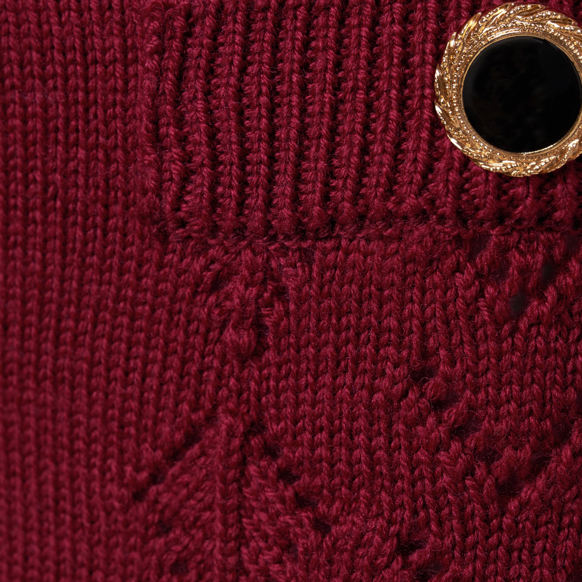 Bordeaux merino wool lace-knit mini skirt cut to a fitted silhouette with pocket details and black and gold-tone buttons.