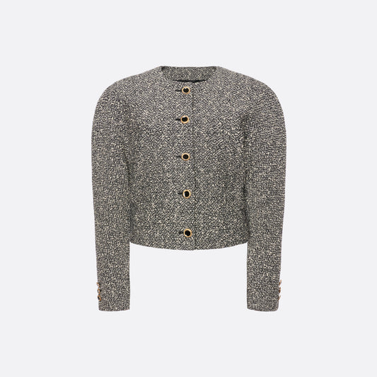 Black and white melange sequin tweed jacket cut in a cropped, boxy silhouette with defined shoulders and finished with black and gold-tone buttons.