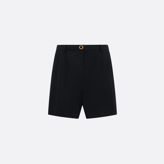 Black wool crêpe bermuda shorts tailored with a high waist and pleats. Finished with pockets and a black and gold-tone button.