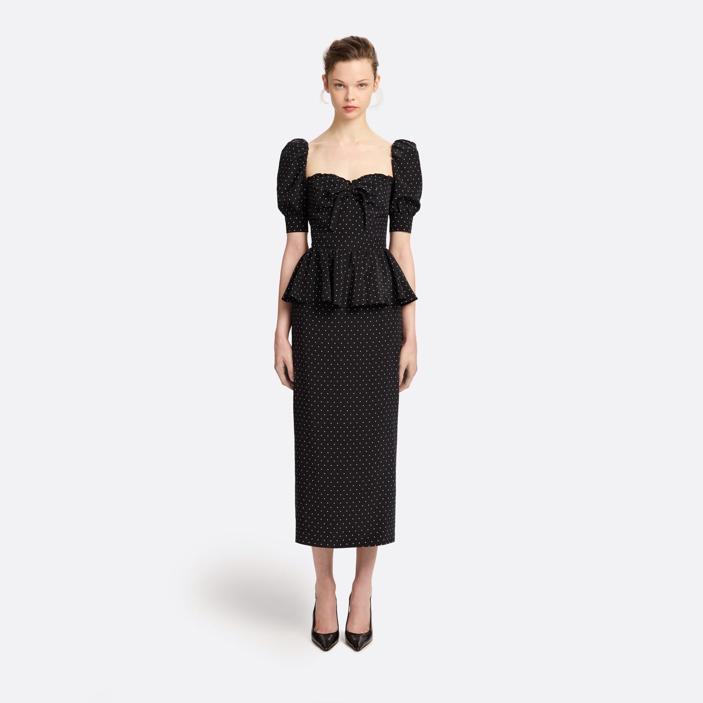 Ivory diamond print on black silk crêpe de chine midi dress with puff sleeves and pencil skirt, featuring a peplum waist and a bow.
