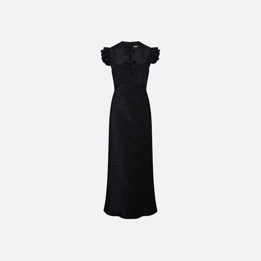 Ivory diamond print on black silk crêpe de chine sleeveless midi dress with bows, featuring keyhole cut-out and ruffled details.