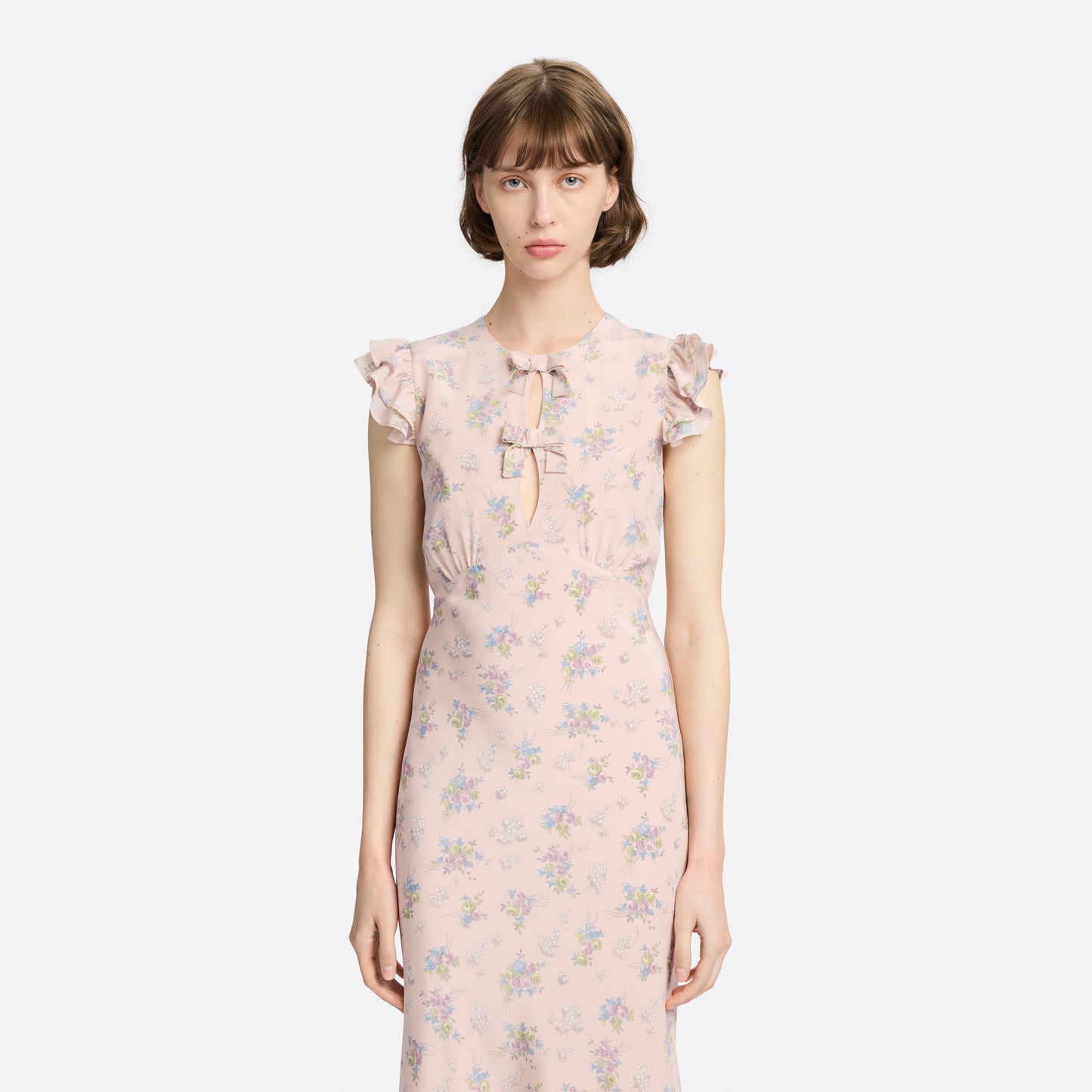 Light rose floral print silk crêpe de chine sleeveless midi dress with bows, featuring keyhole cut-out and ruffled details.