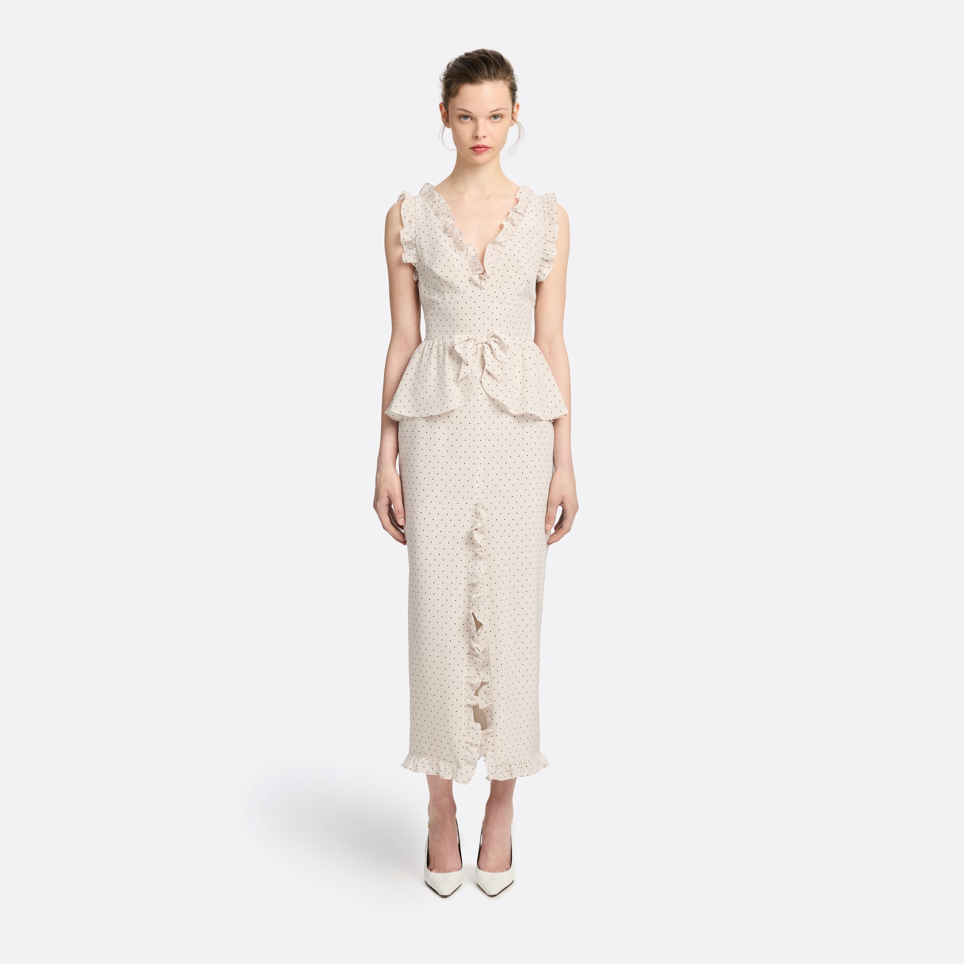 Brown diamond print on almond silk crêpe de chine midi dress with a deep V neckline and ruffled trims, featuring a peplum waist, front split and bow.