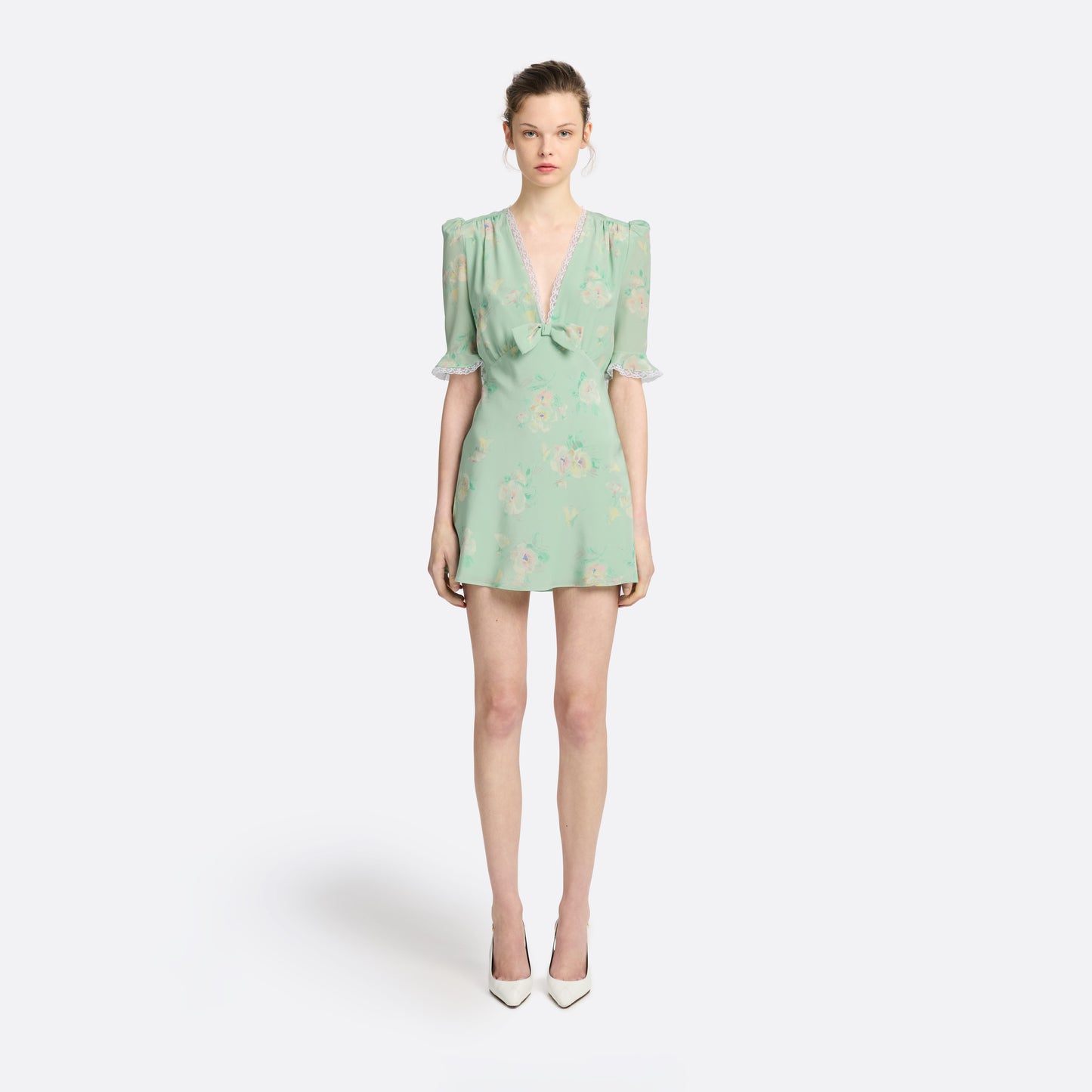 Light green floral print silk crêpe de chine mini dress with a V neckline and short sleeves, featuring lace trims and a bow.