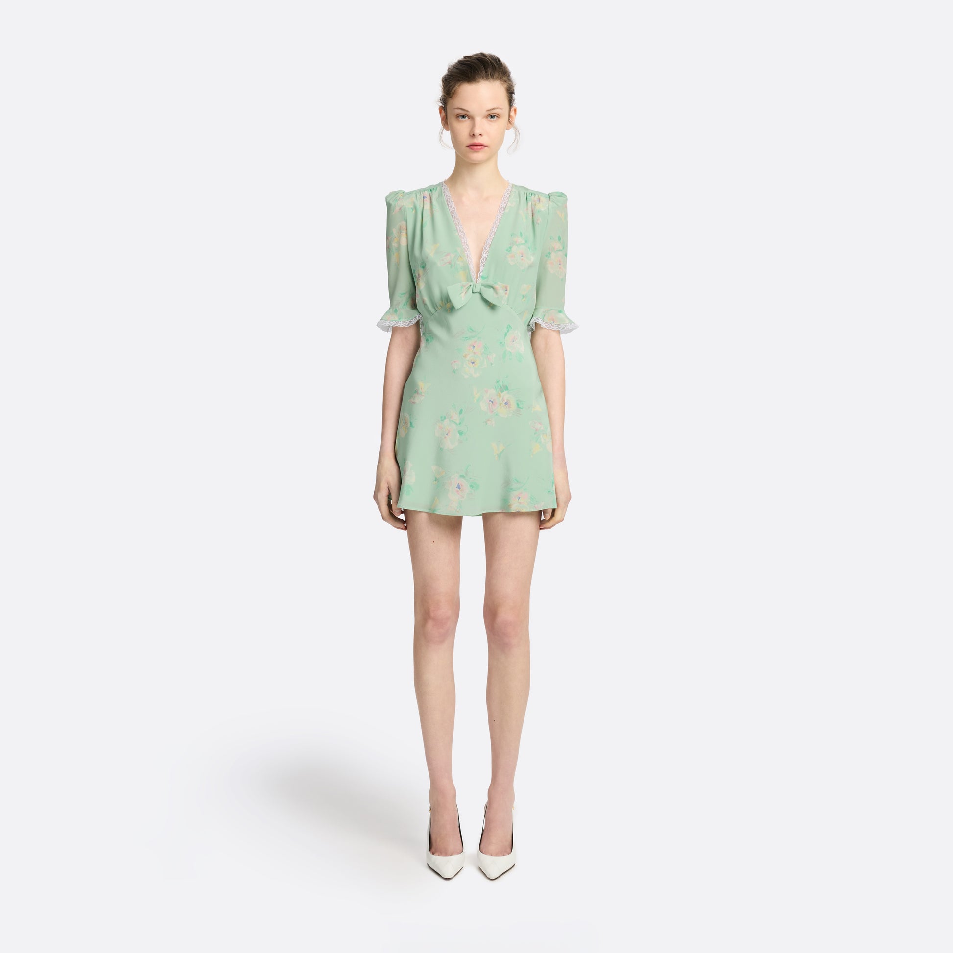 Light green floral print silk crêpe de chine mini dress with a V neckline and short sleeves, featuring lace trims and a bow.