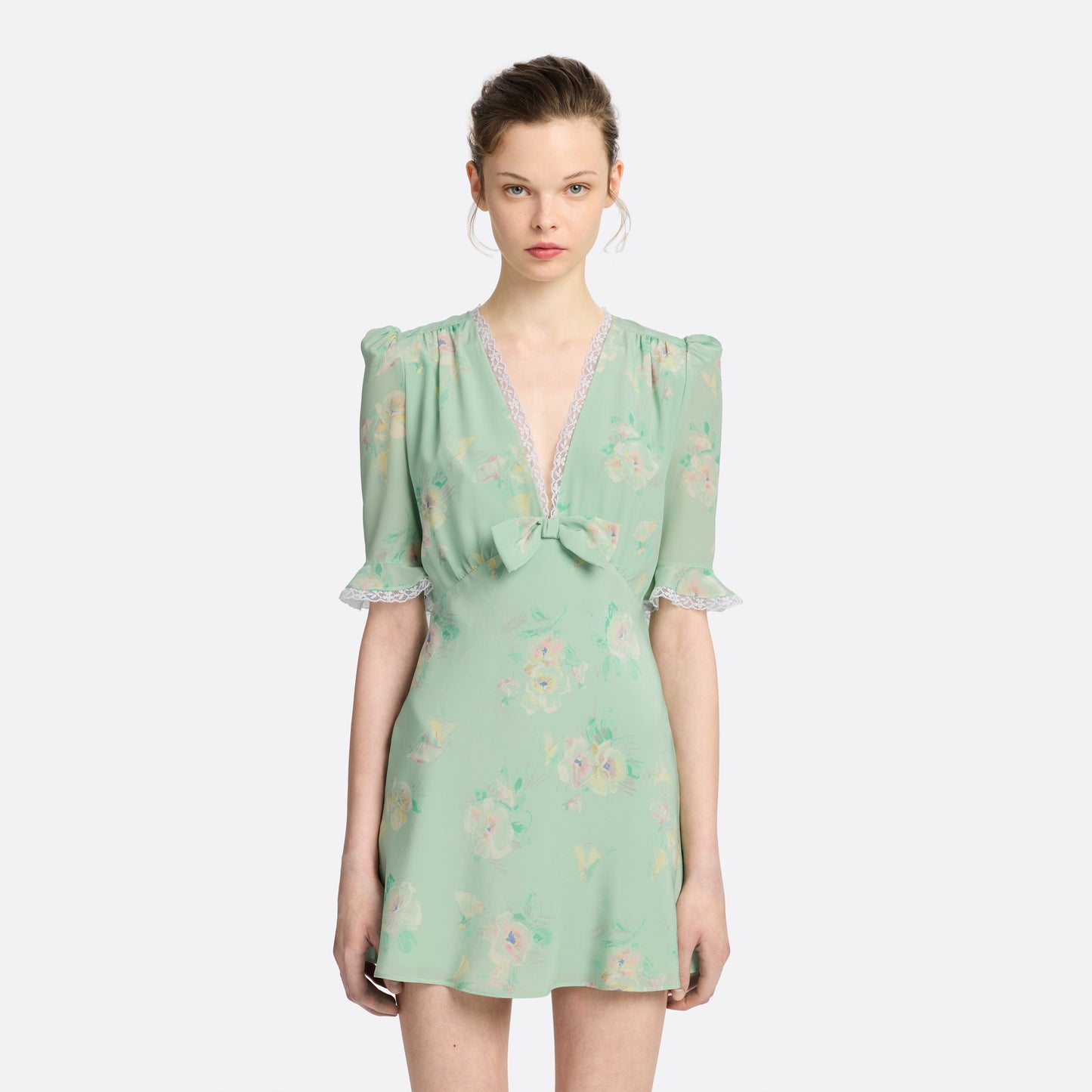 Light green floral print silk crêpe de chine mini dress with a V neckline and short sleeves, featuring lace trims and a bow.