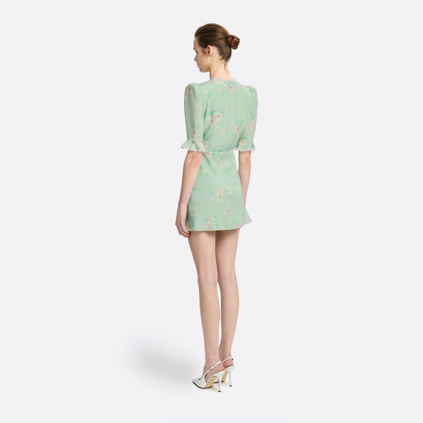 Light green floral print silk crêpe de chine mini dress with a V neckline and short sleeves, featuring lace trims and a bow.