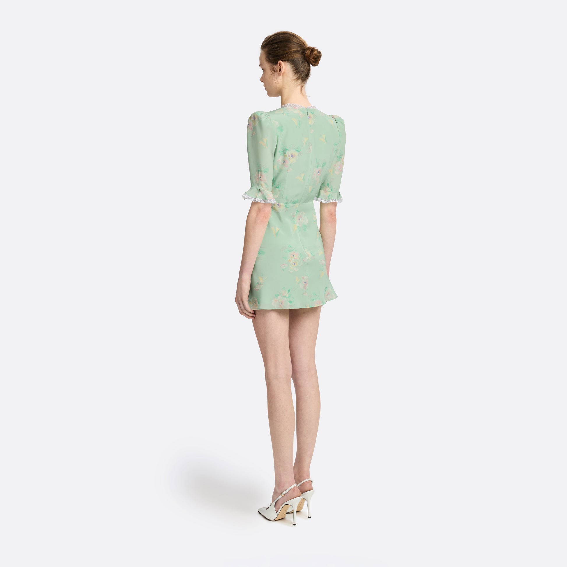 Light green floral print silk crêpe de chine mini dress with a V neckline and short sleeves, featuring lace trims and a bow.