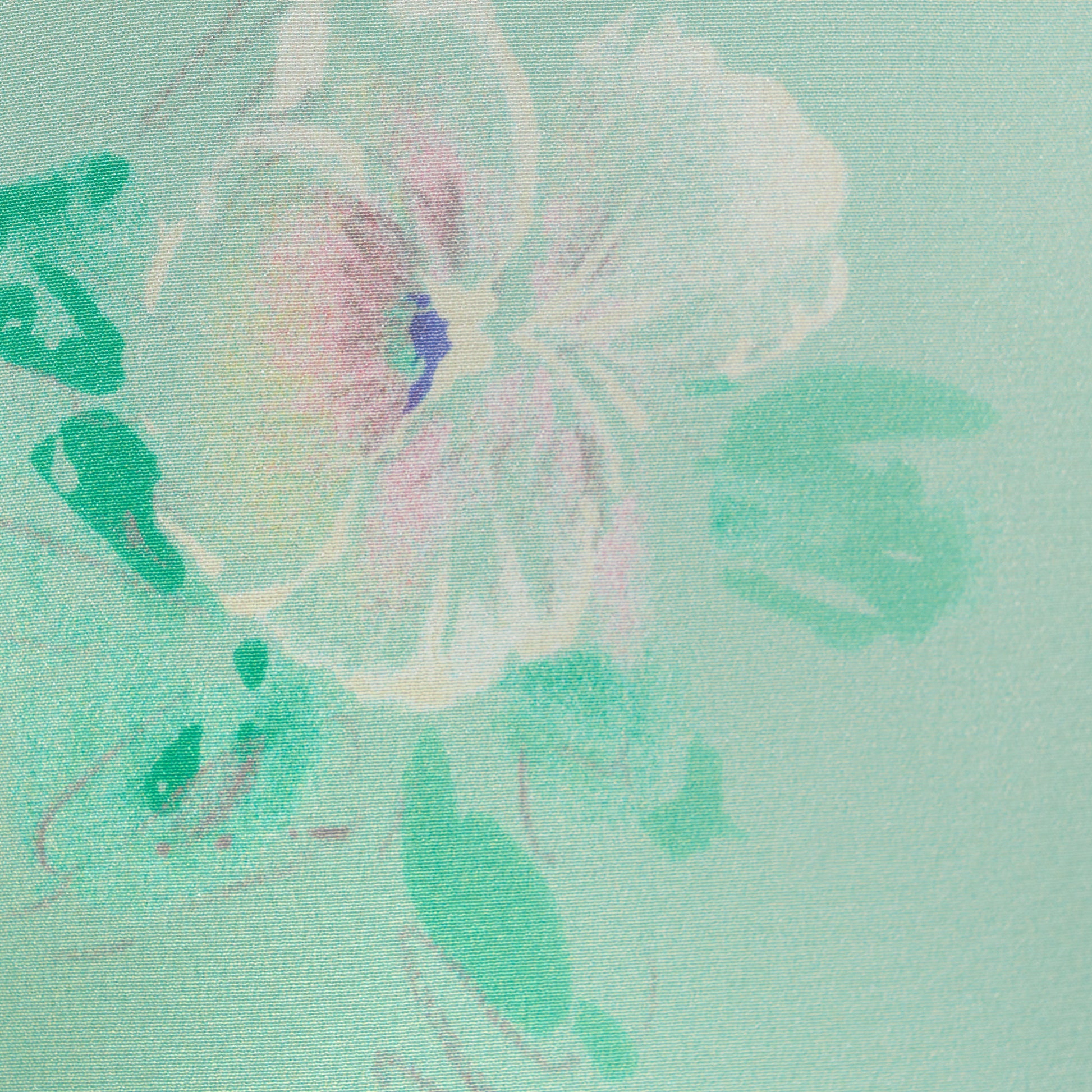 Green printed silk crêpe de chine mini dress with a V neckline and short sleeves, featuring lace trim and a bow.