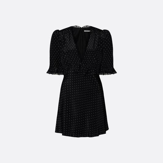 Ivory print on black silk crêpe de chine mini dress with a V neckline and short sleeves, featuring lace trim and a bow.