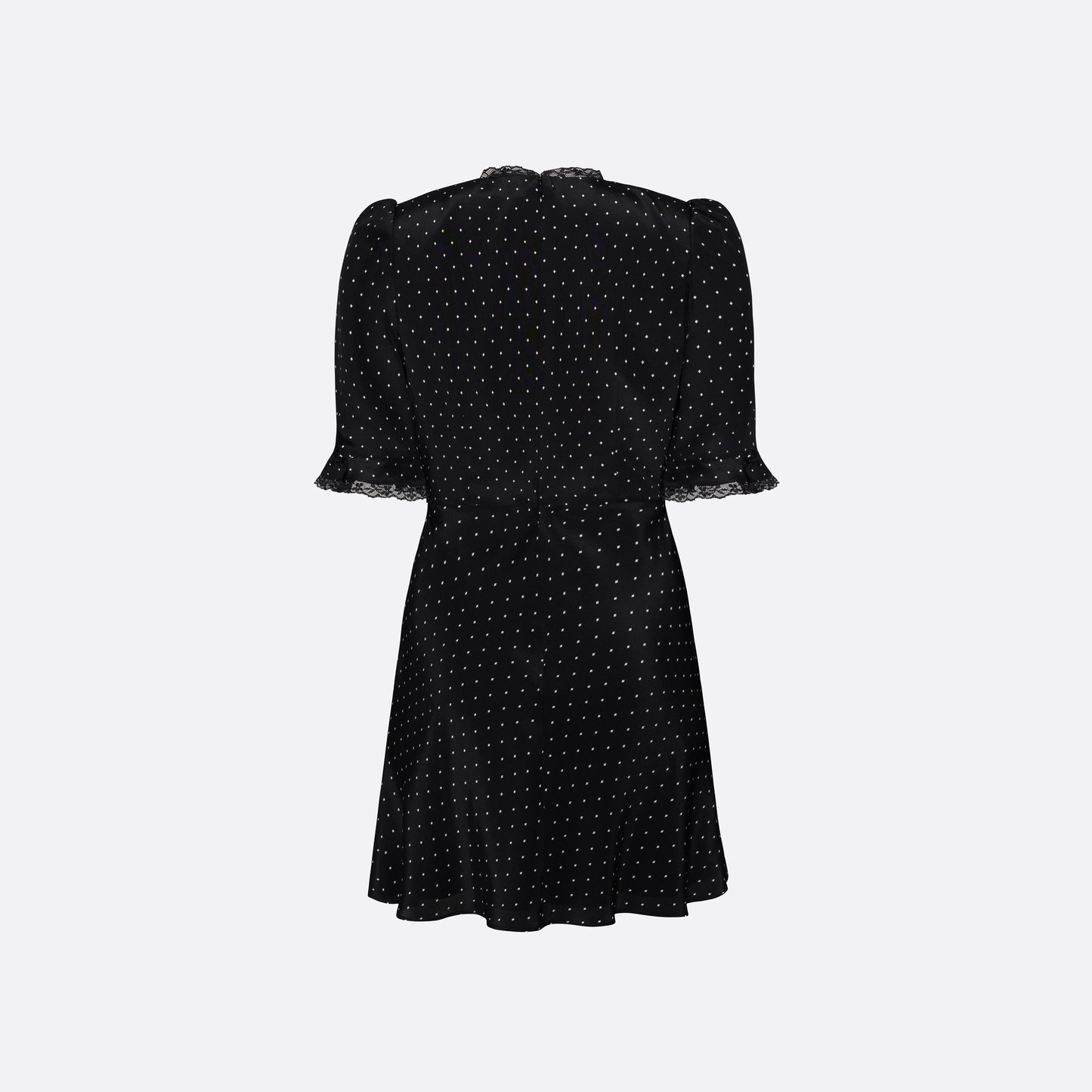 Ivory diamond print on black silk crêpe de chine mini dress with a V neckline and short sleeves, featuring lace trims and a bow.