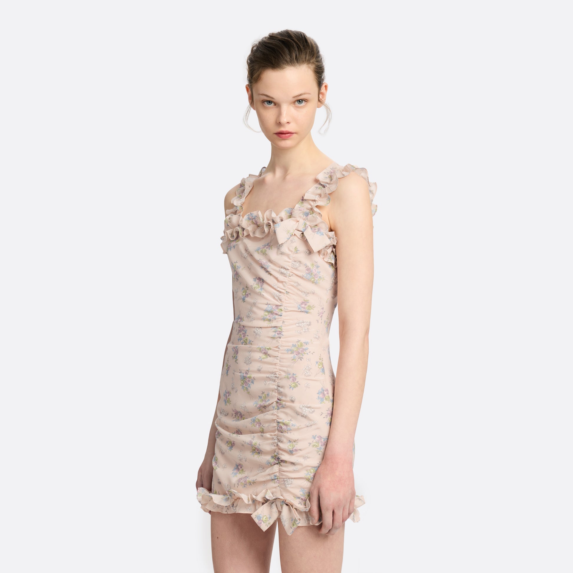 Light rose floral print silk crêpe de chine sleeveless mini dress, featuring ruched detailing and ruffled trims.