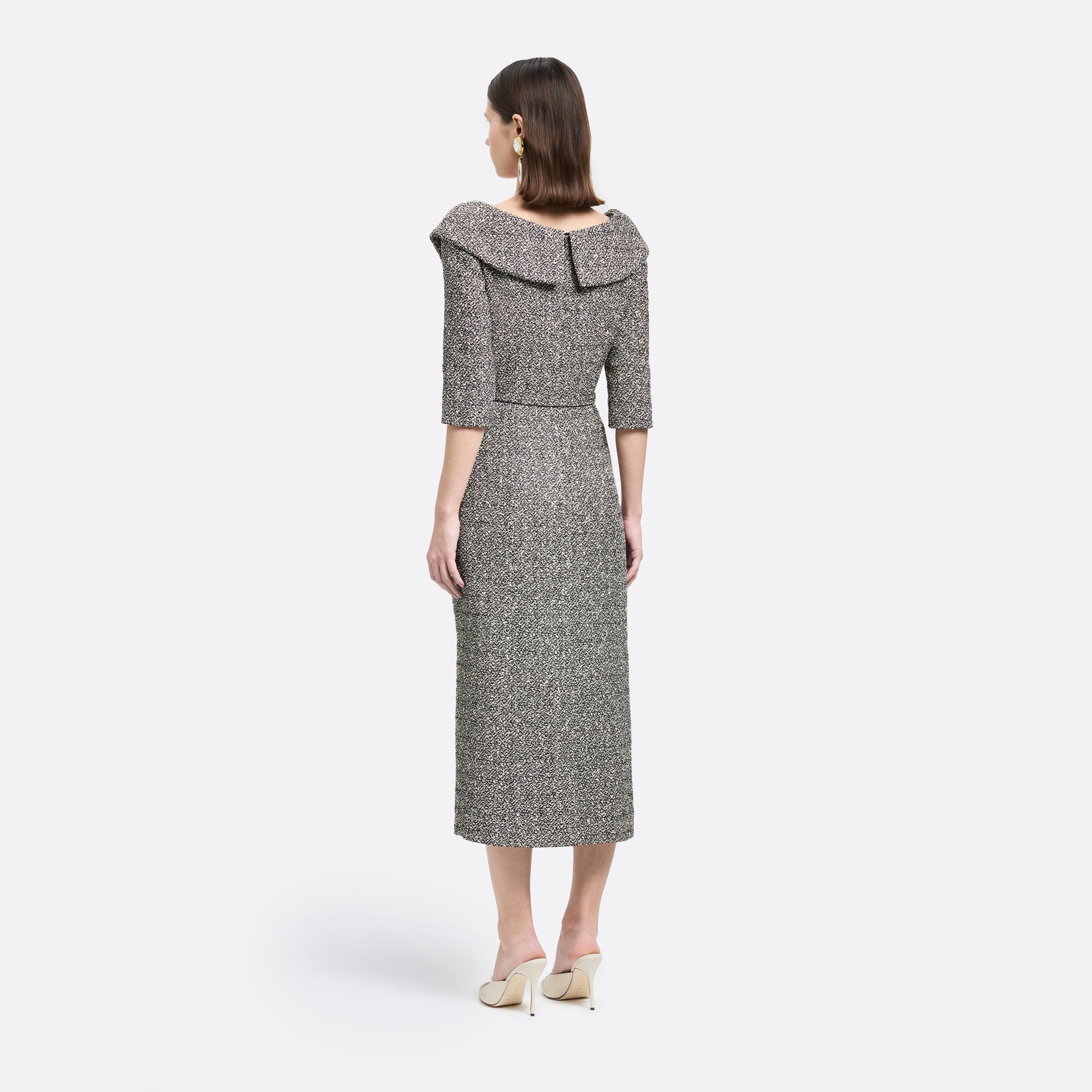 Black and white melange sequins tweed midi dress cut to a fitted silhouette with black and gold-tone buttons and a slim belt.

Look 12 – Fall Winter 2026 Lookbook.