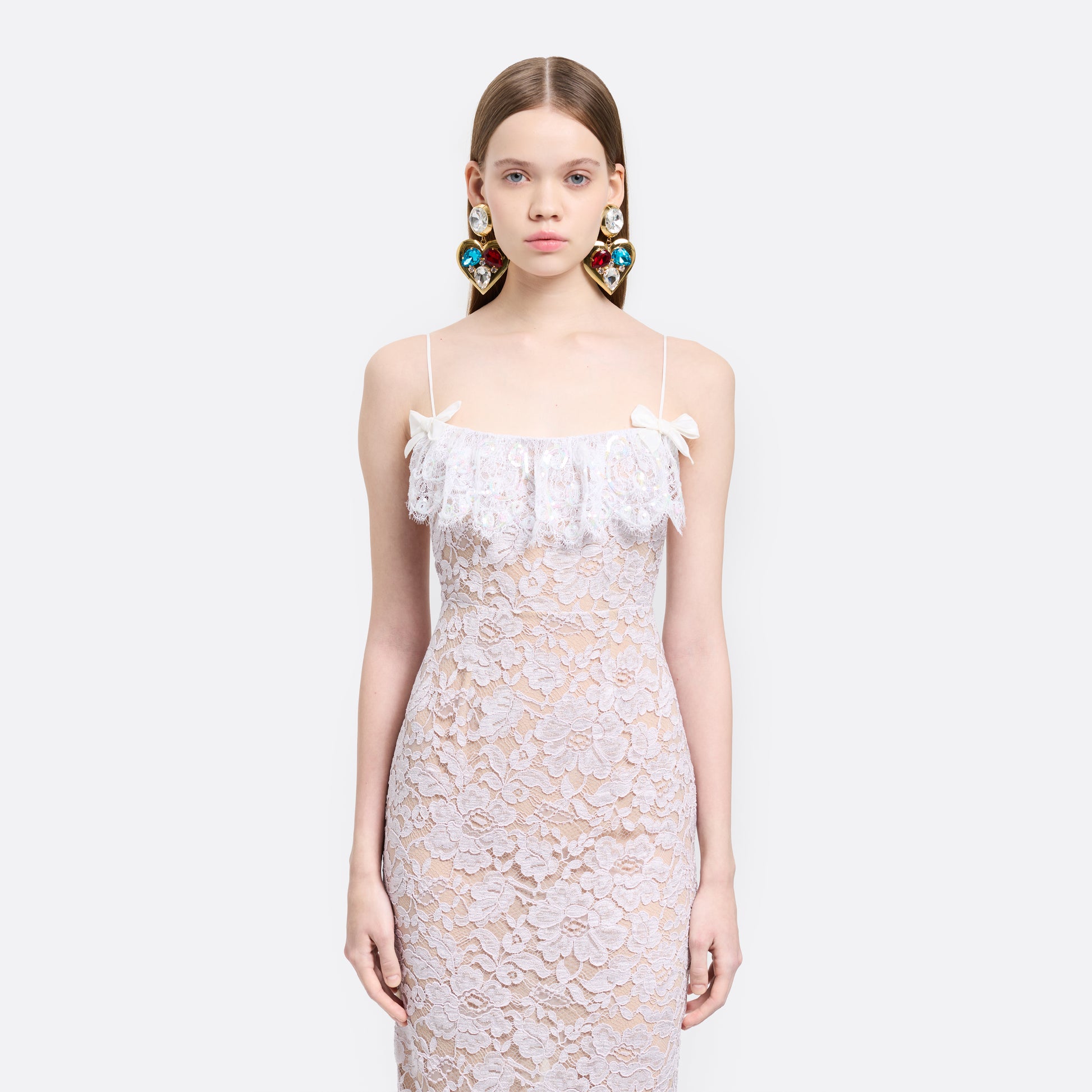 Lavender lace slip dress cut to a fitted silhouette with spaghetti straps and a straight neckline framed by a sequin-embroidered lace volant.