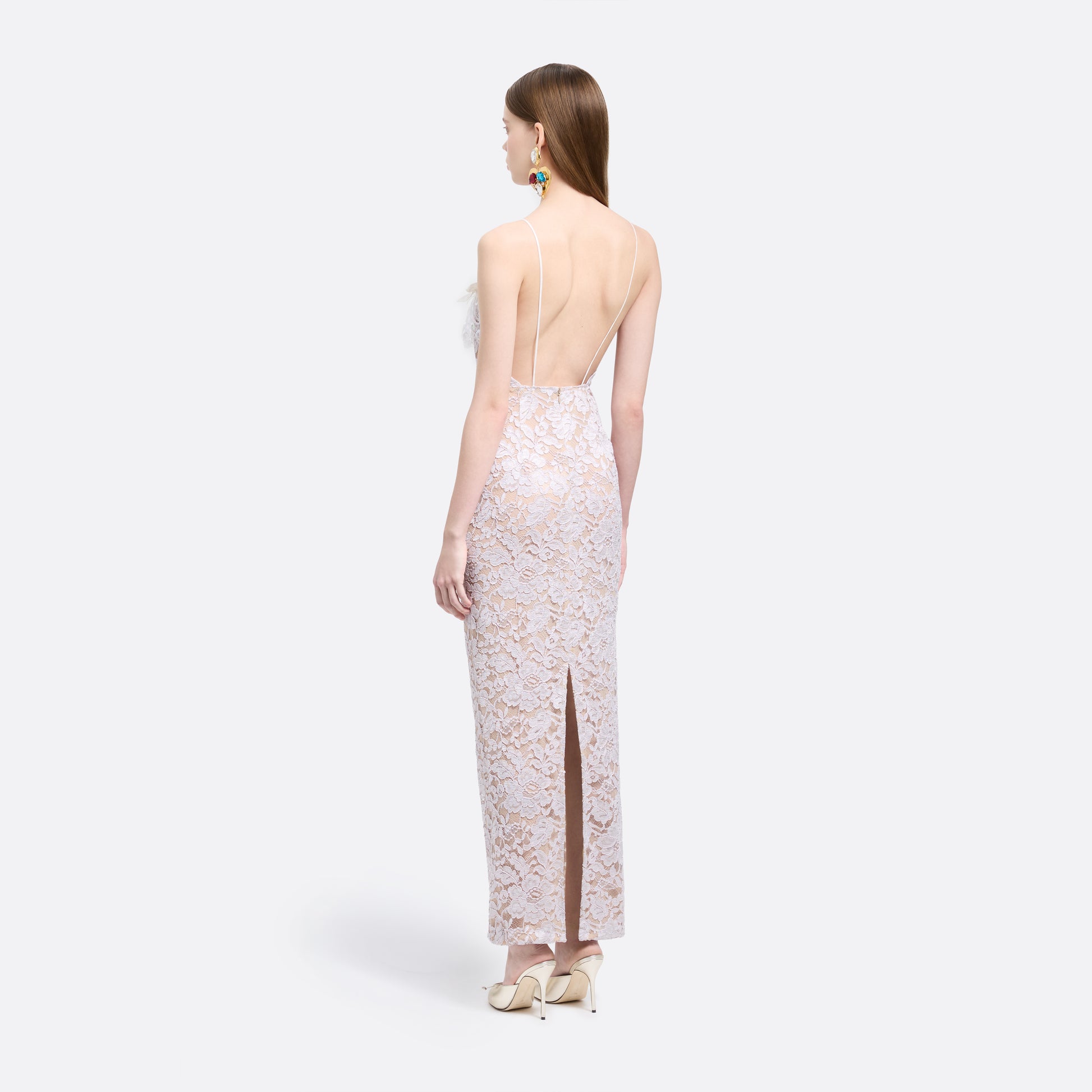 Lavender lace slip dress cut to a fitted silhouette with spaghetti straps and a straight neckline framed by a sequin-embroidered lace volant.