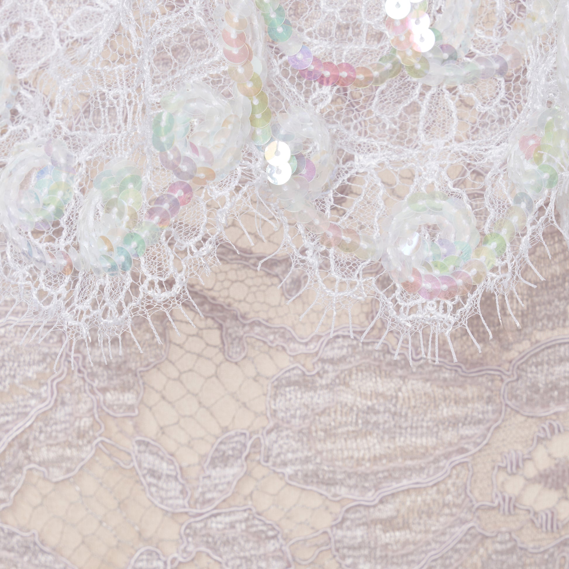 Lavender lace slip dress cut to a fitted silhouette with spaghetti straps and a straight neckline framed by a sequin-embroidered lace volant.