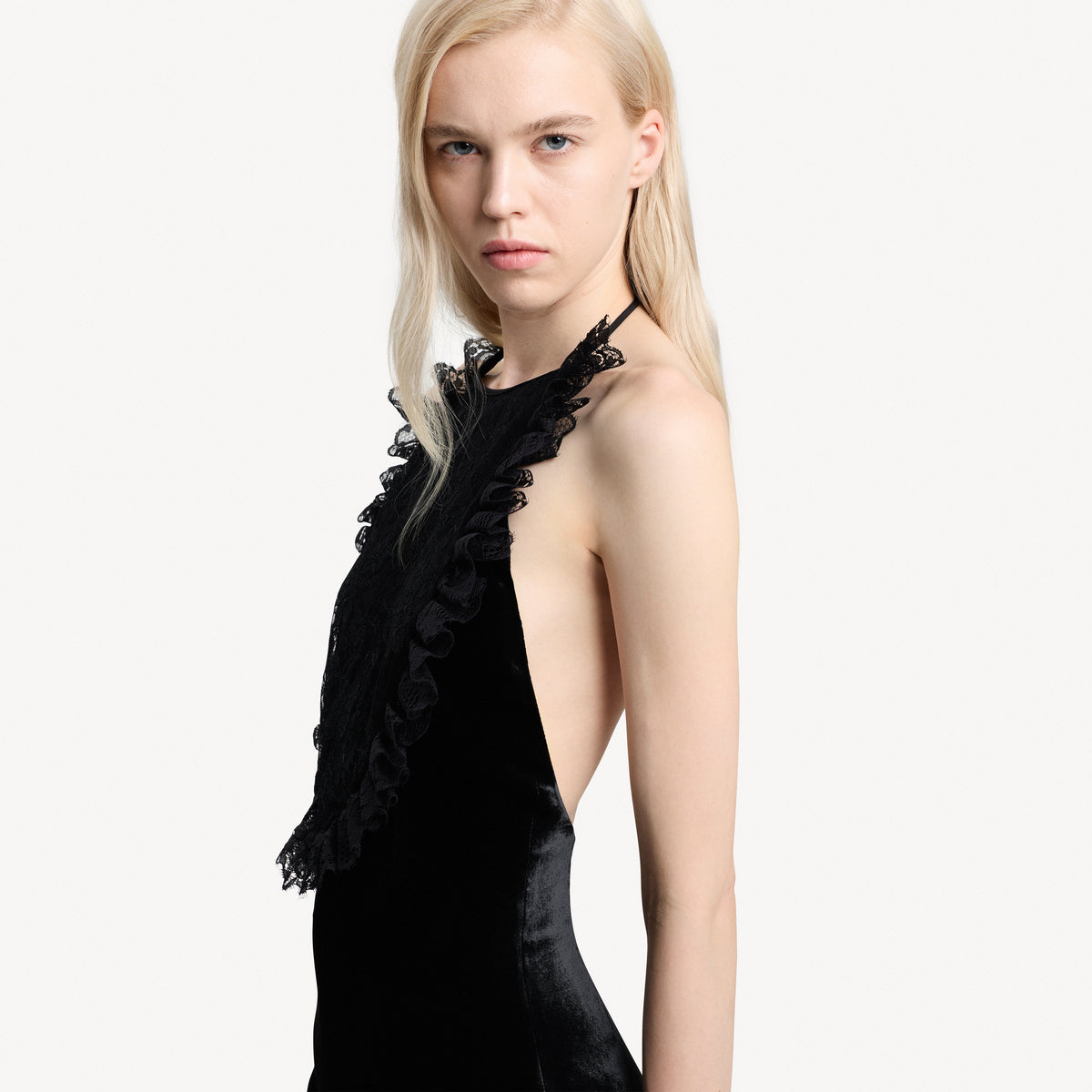 Black silk velvet evening dress featuring an open back and black lace inlay with ruffle trims.

Look 25 – Spring Summer 2027 Lookbook