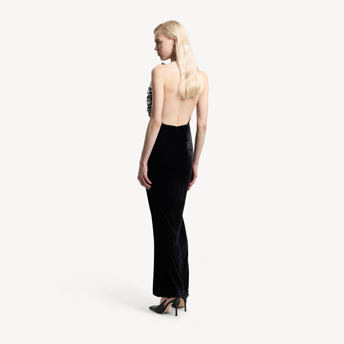 Black silk velvet evening dress featuring an open back and black lace inlay with ruffle trims.

Look 25 – Spring Summer 2027 Lookbook