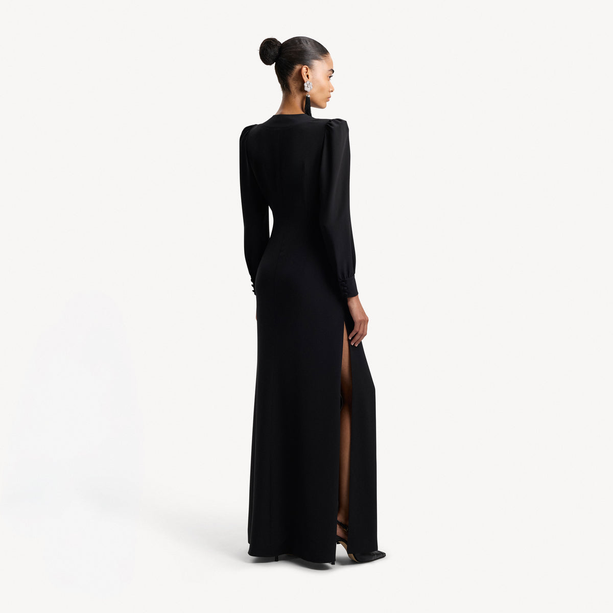 Black silk crêpe de chine evening dress with high side splits and puffed long sleeves, featuring pockets and jewel buttons.

Look 9 – Spring Summer 2027 Lookbook